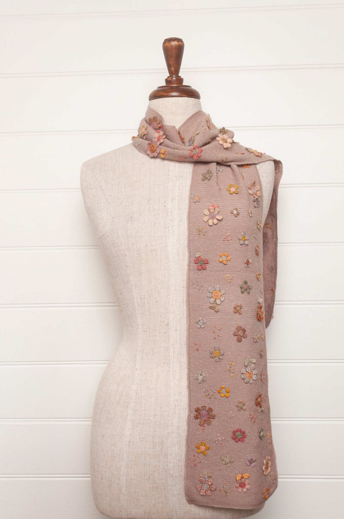 Sophie Digard flower sampler crocheted scarf in soft pastel palette on lilac base.