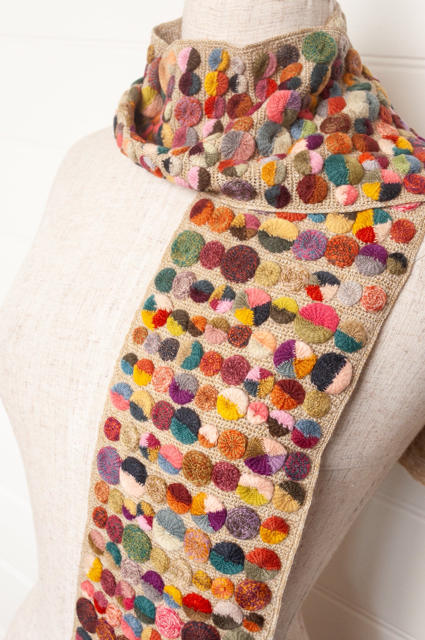 Sophie Digard crochet scarf of multi coloured medallions on natural base.