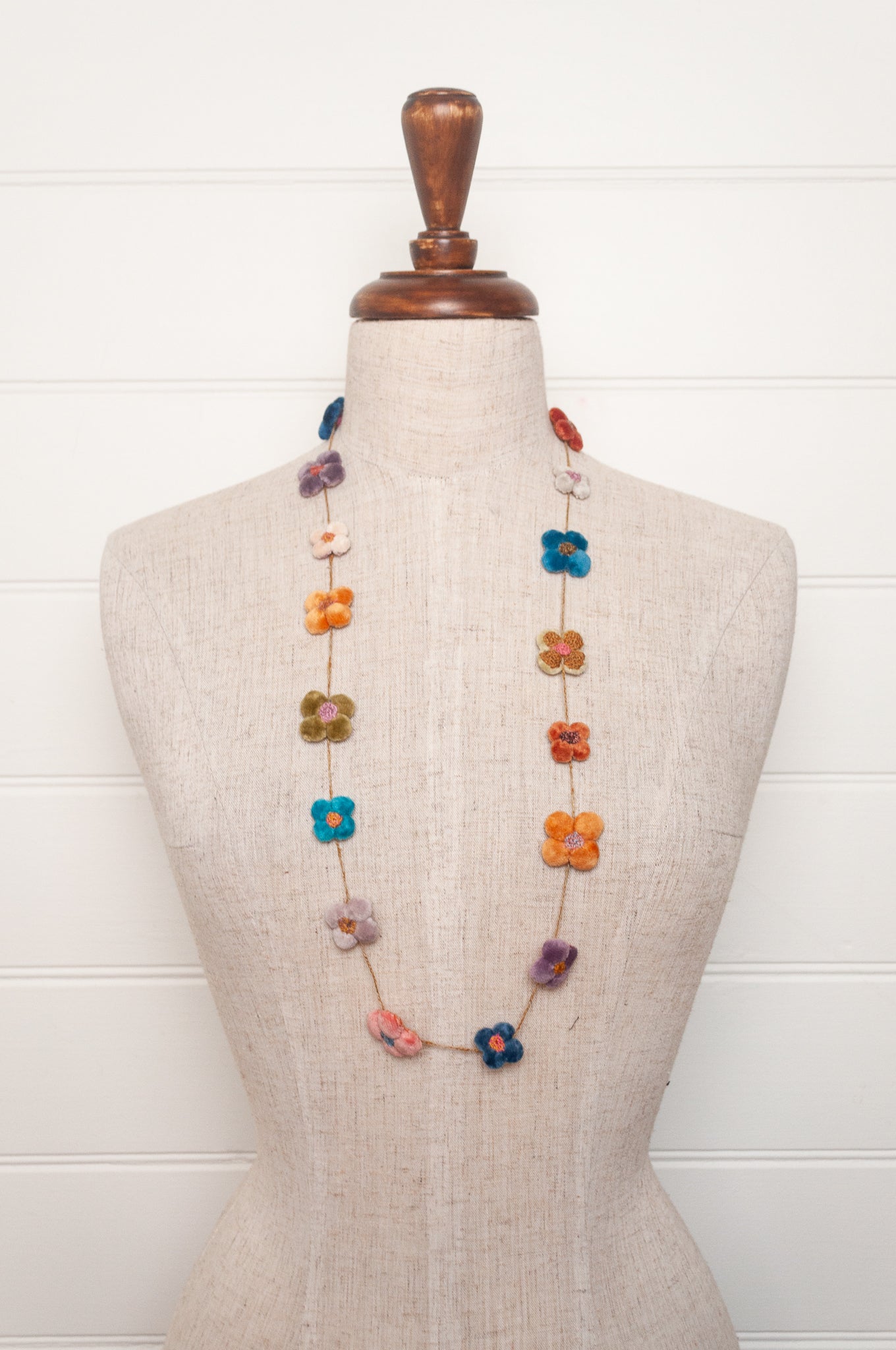Sophie Digard velvet four petal flower necklace in bright pastels.