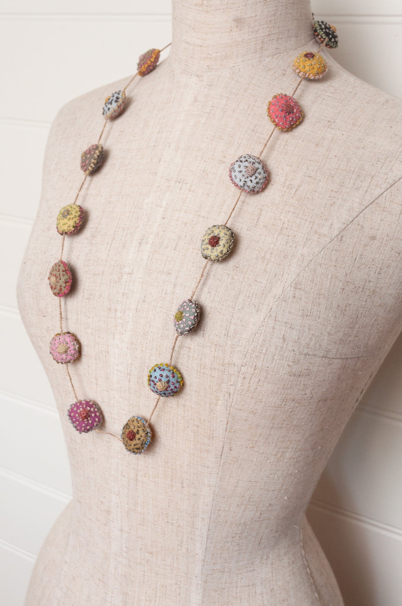 Sophie Digard necklace of embroidered linen medallions.