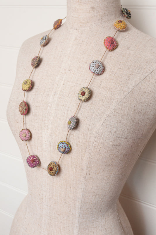 Sophie Digard necklace of embroidered linen medallions.