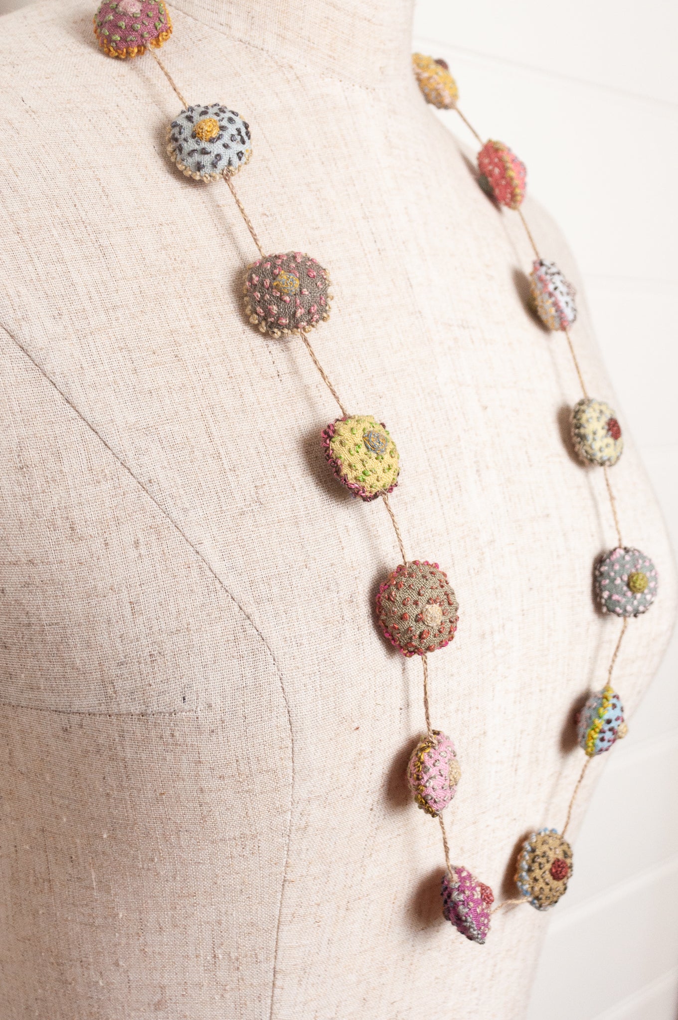 Sophie Digard necklace of embroidered linen medallions.