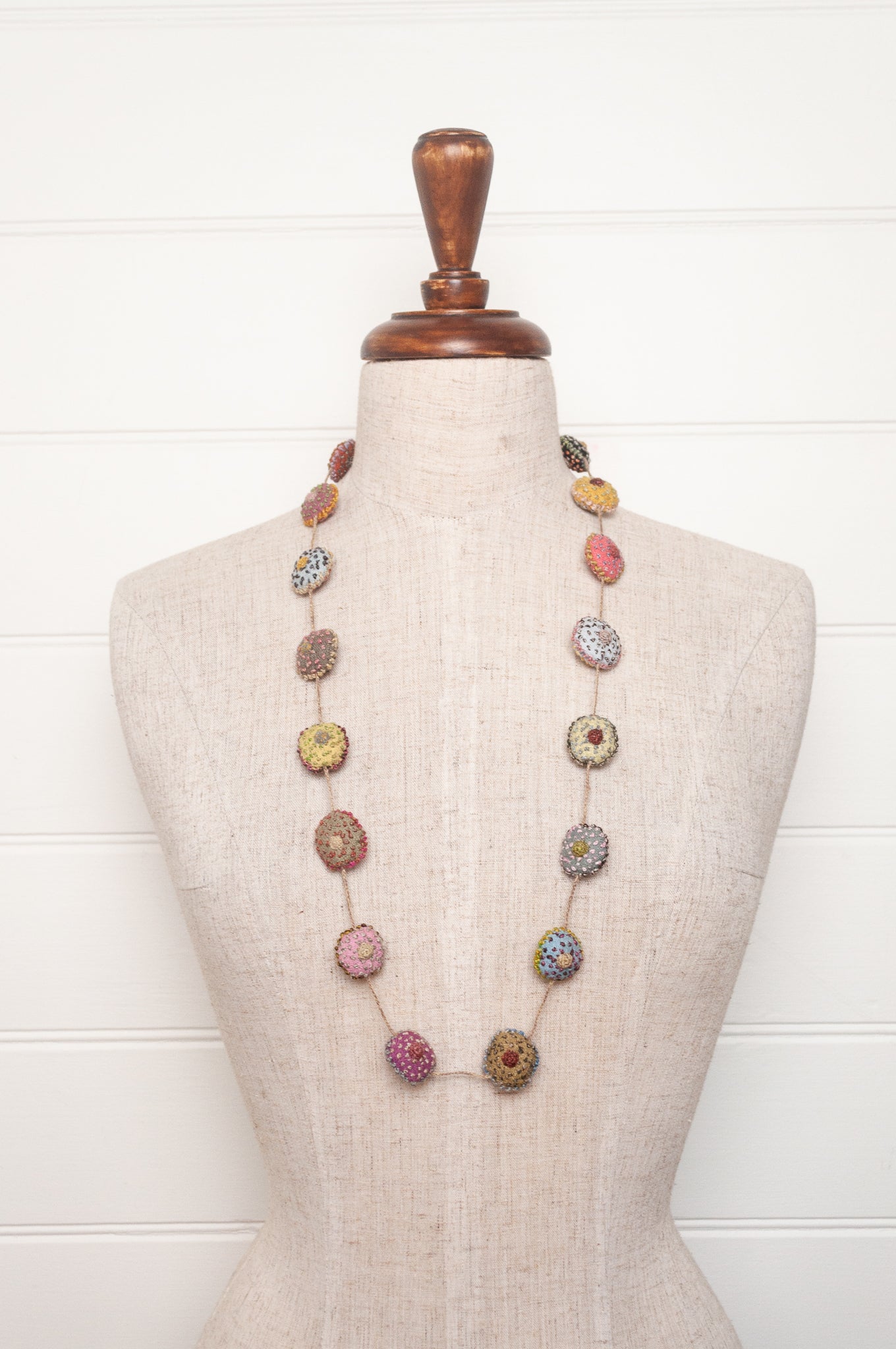 Sophie Digard necklace of embroidered linen medallions.