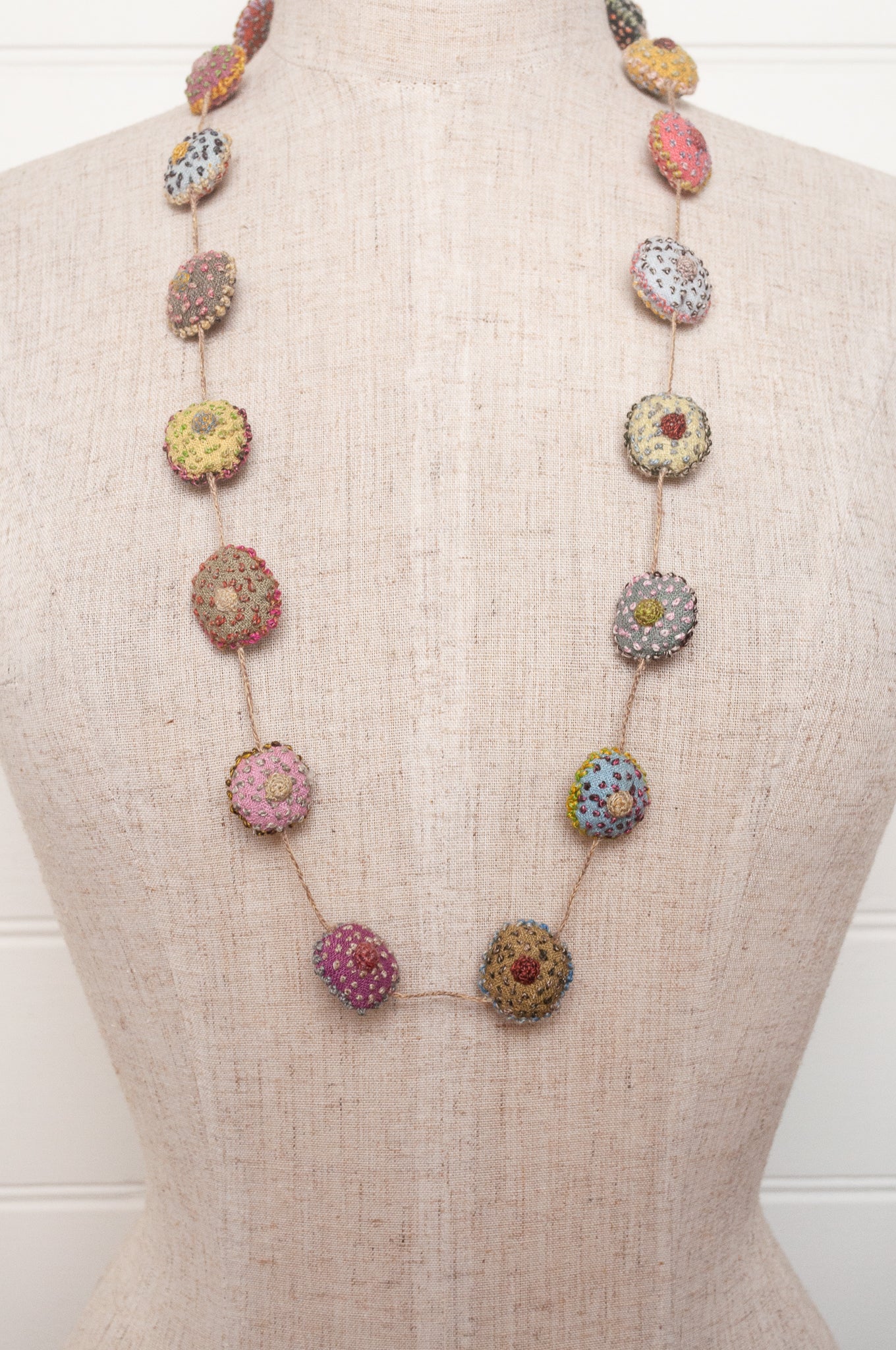 Sophie Digard necklace of embroidered linen medallions.