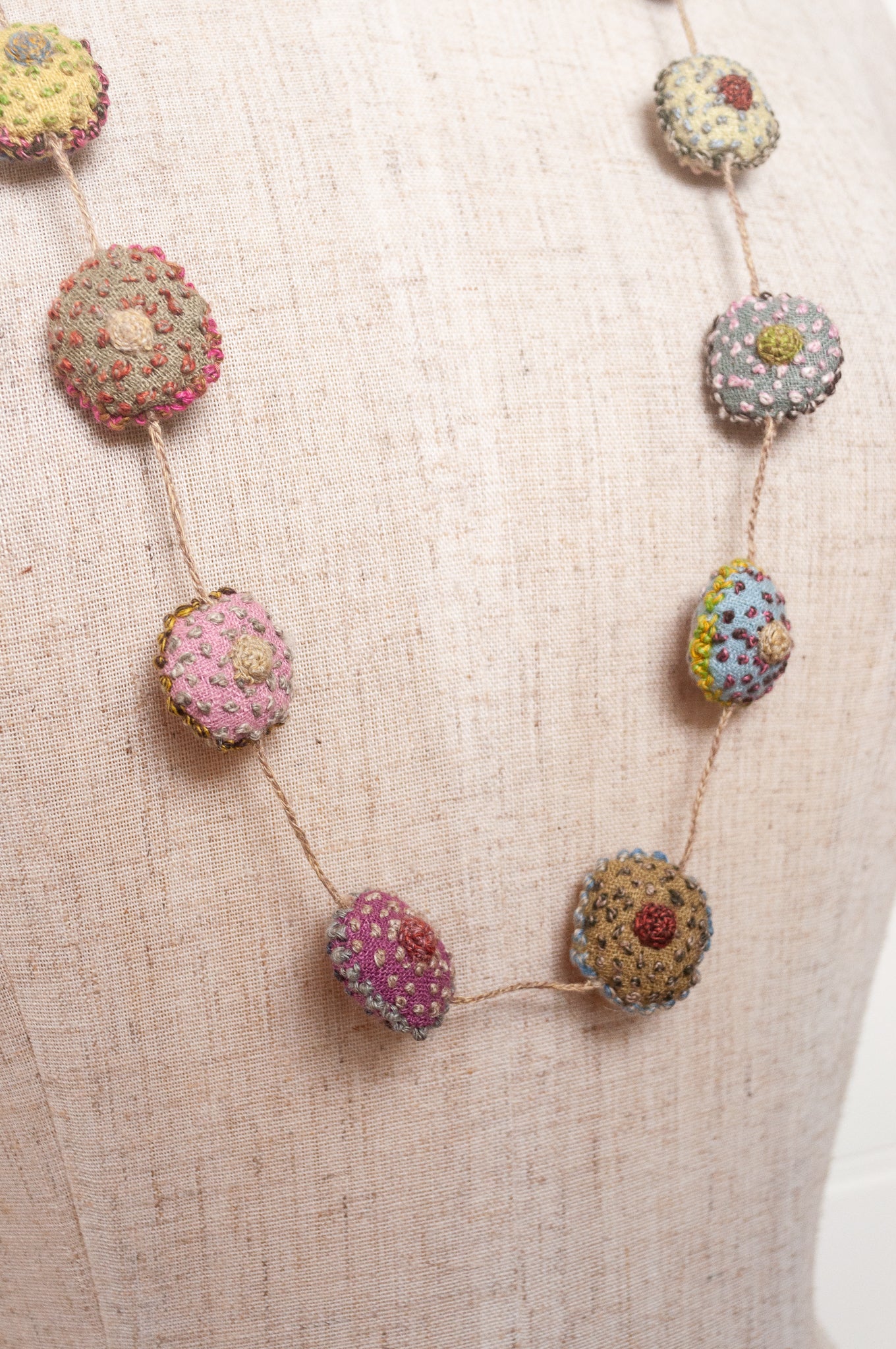 Sophie Digard necklace of embroidered linen medallions.