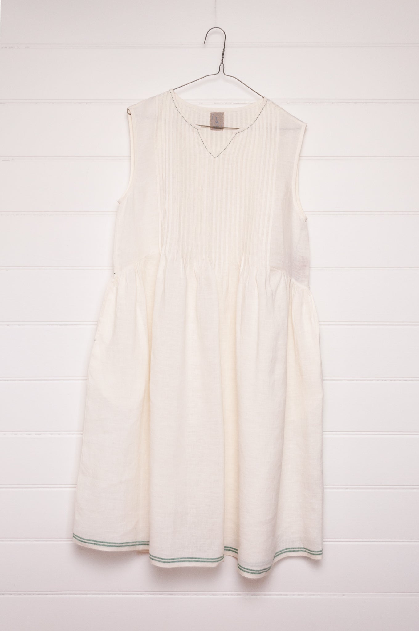 DVE Bhavya natural white linen sleeveless pintucked sun dress.
