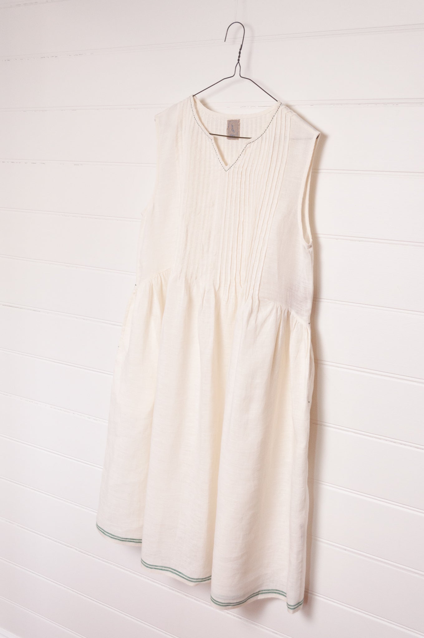 DVE Bhavya natural white linen sleeveless pintucked sun dress.
