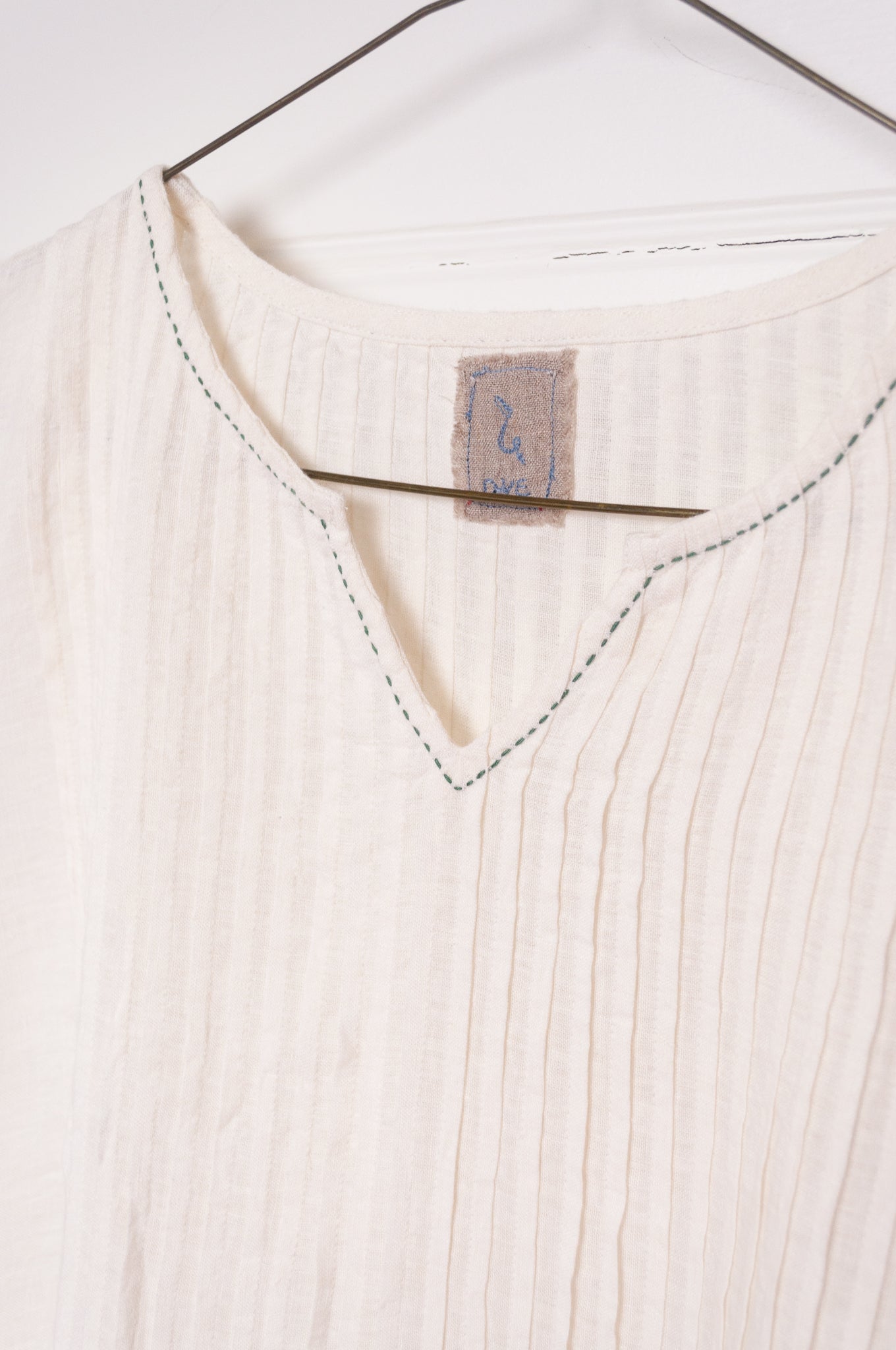 DVE Bhavya natural white linen sleeveless pintucked sun dress.