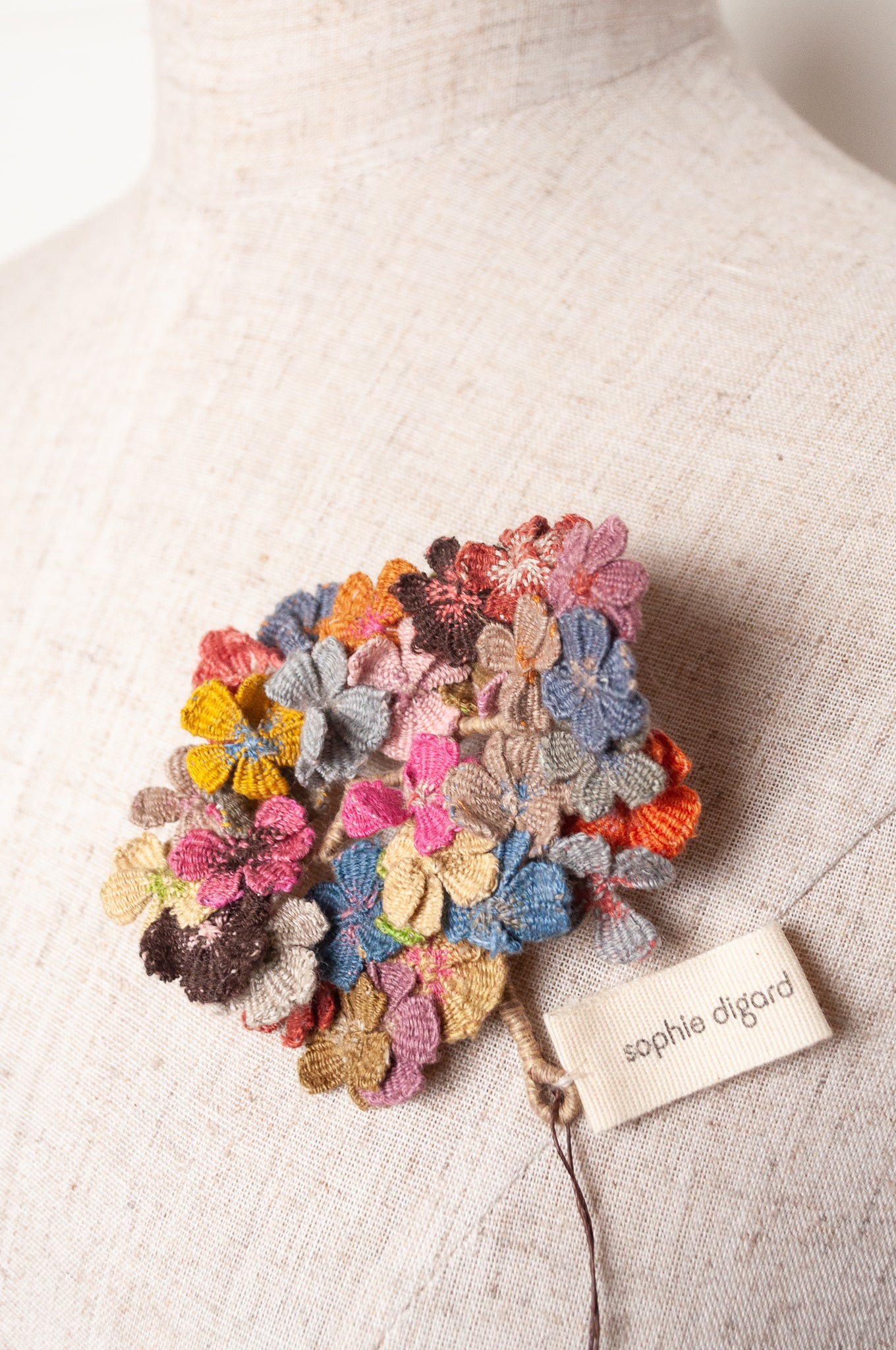Sophie Digard multicoloured crochet floral brooch.