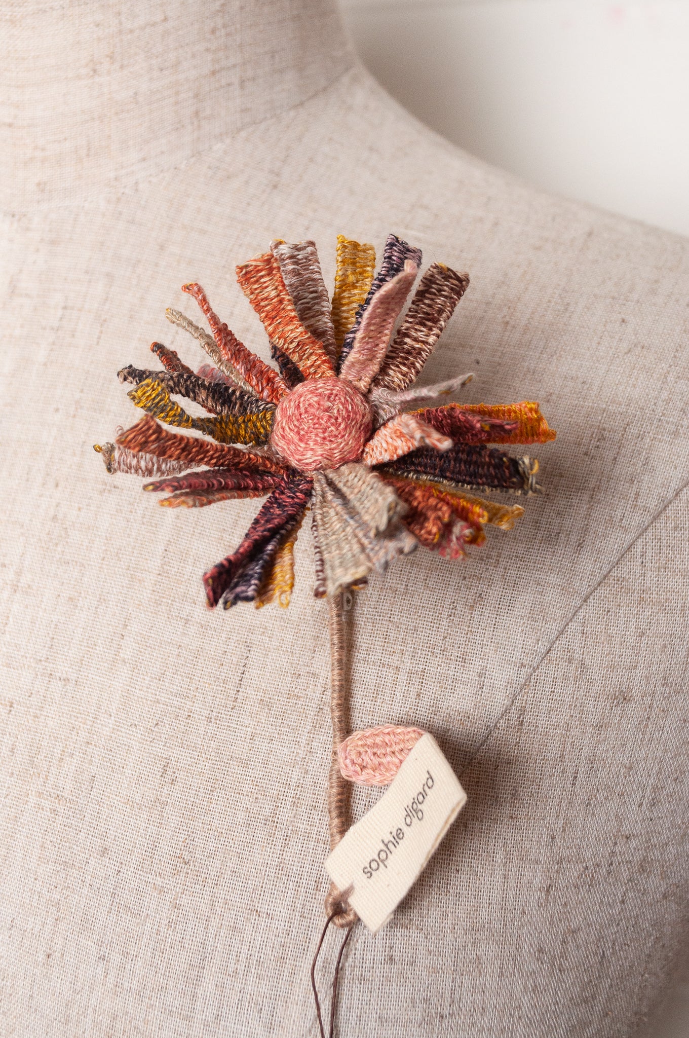 Sophie Digard multicoloured crochet flower brooch.
