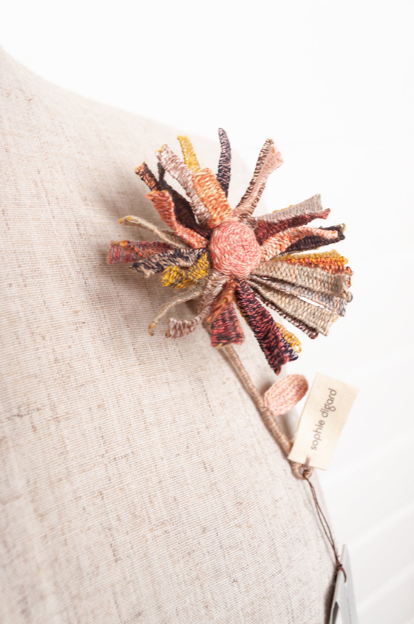Sophie Digard multicoloured crochet flower brooch.
