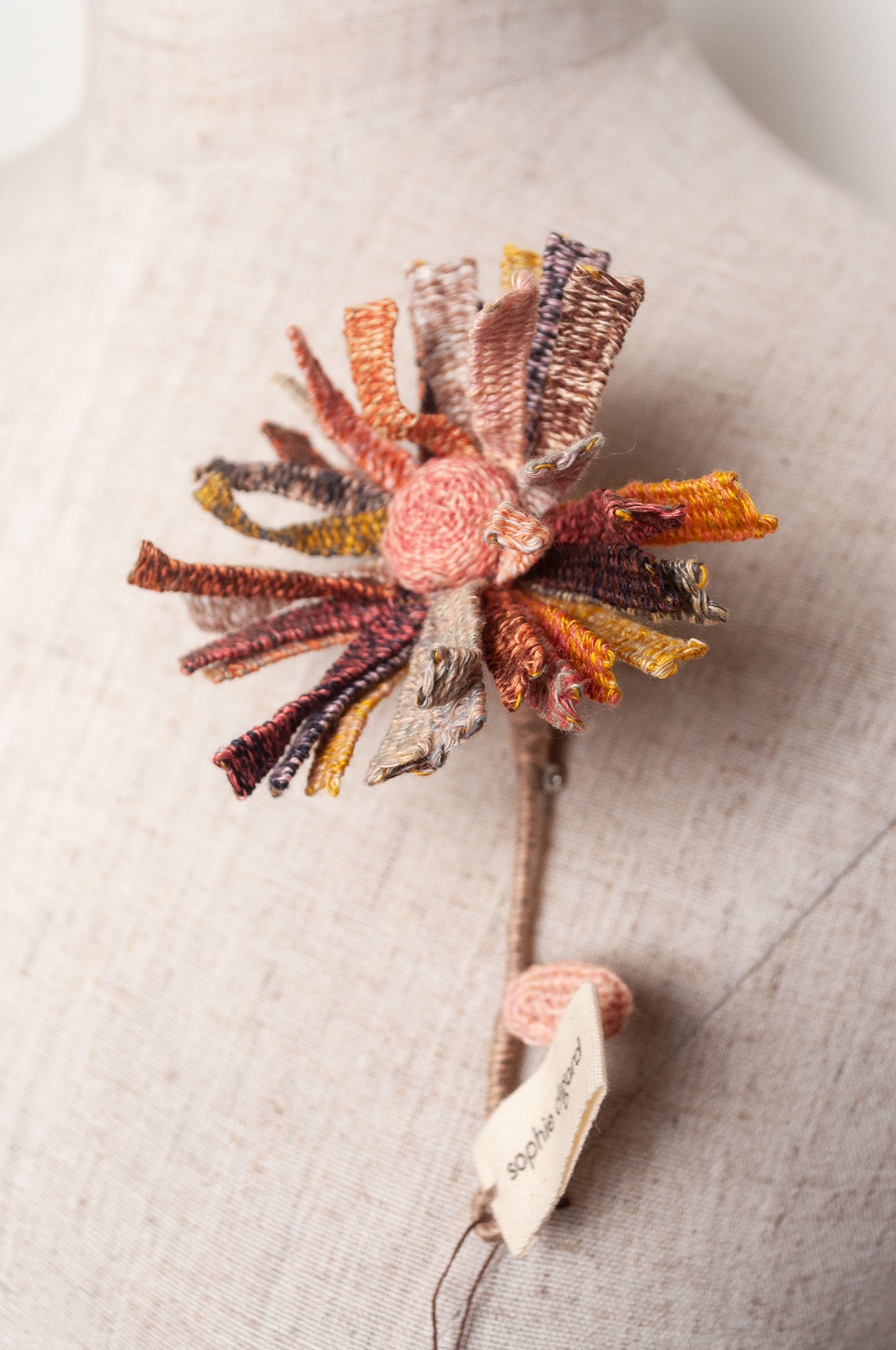 Sophie Digard multicoloured crochet flower brooch.