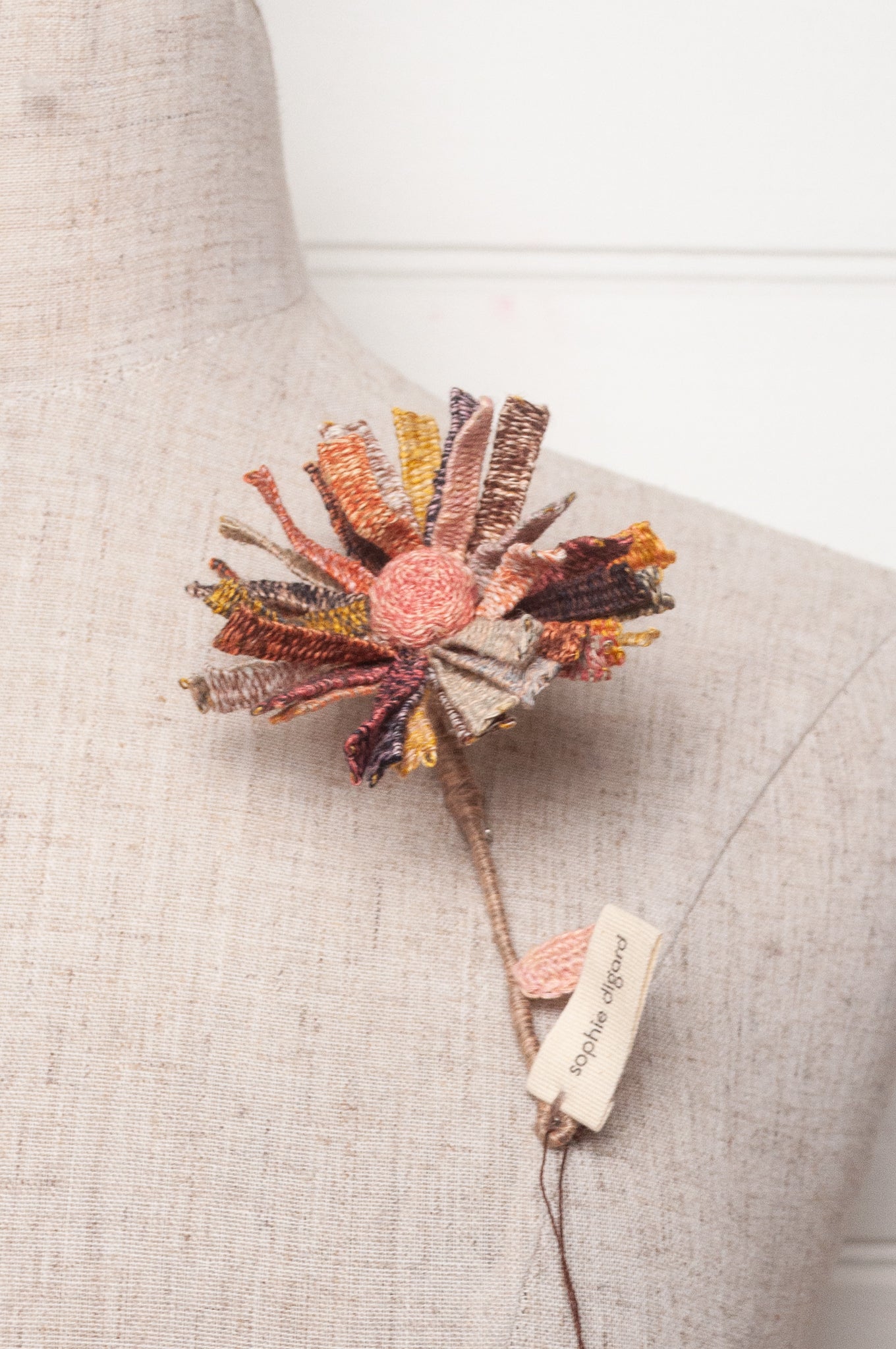 Sophie Digard multicoloured crochet flower brooch.