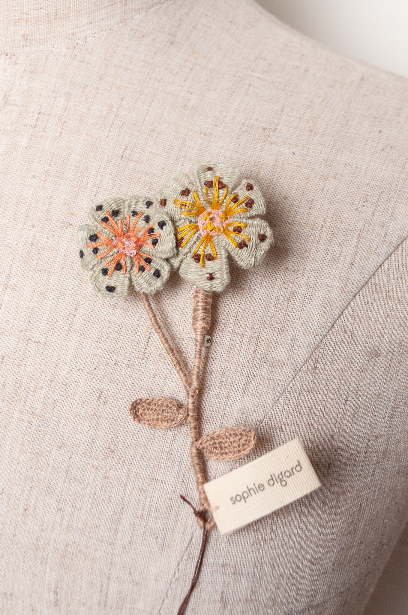 Sophie Digard two flower brooch in pale blue.