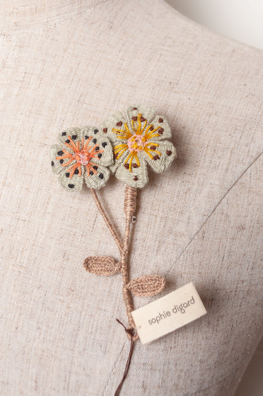 Sophie Digard two flower brooch in pale blue.