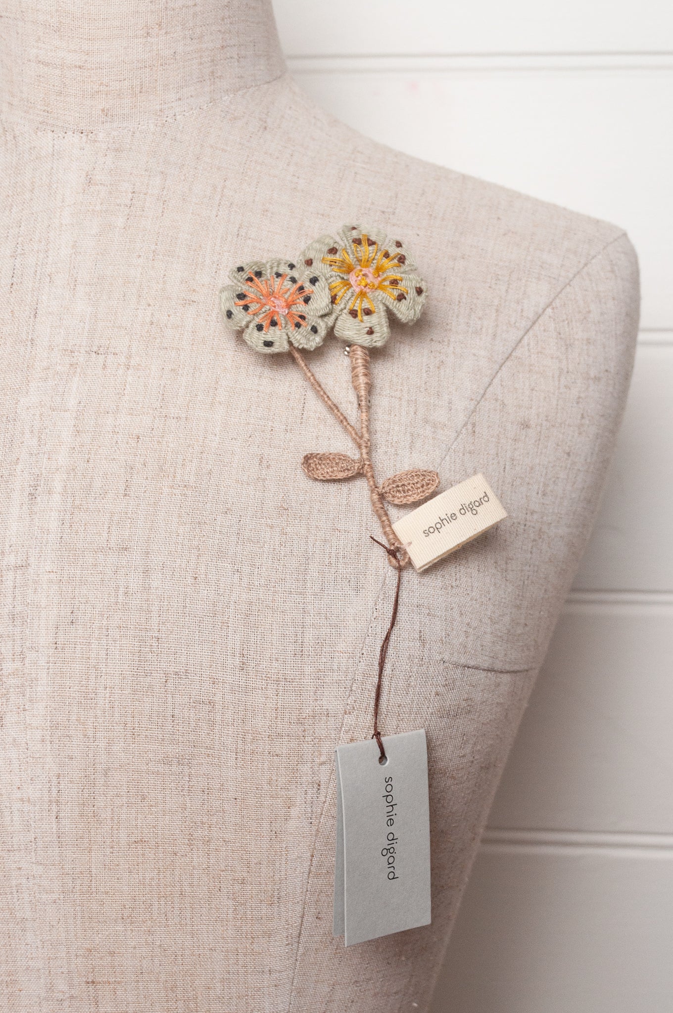 Sophie Digard two flower brooch in pale blue.