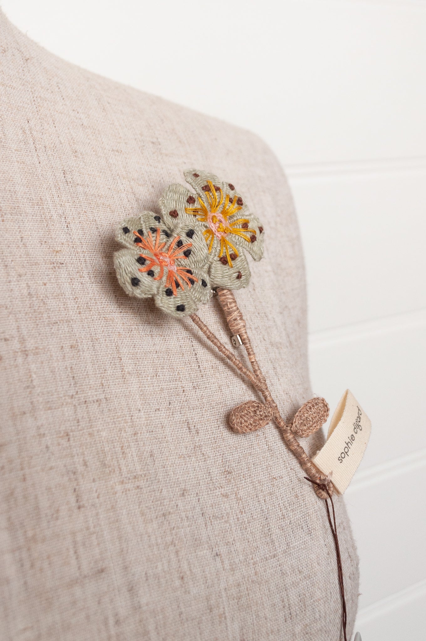 Sophie Digard two flower brooch in pale blue.