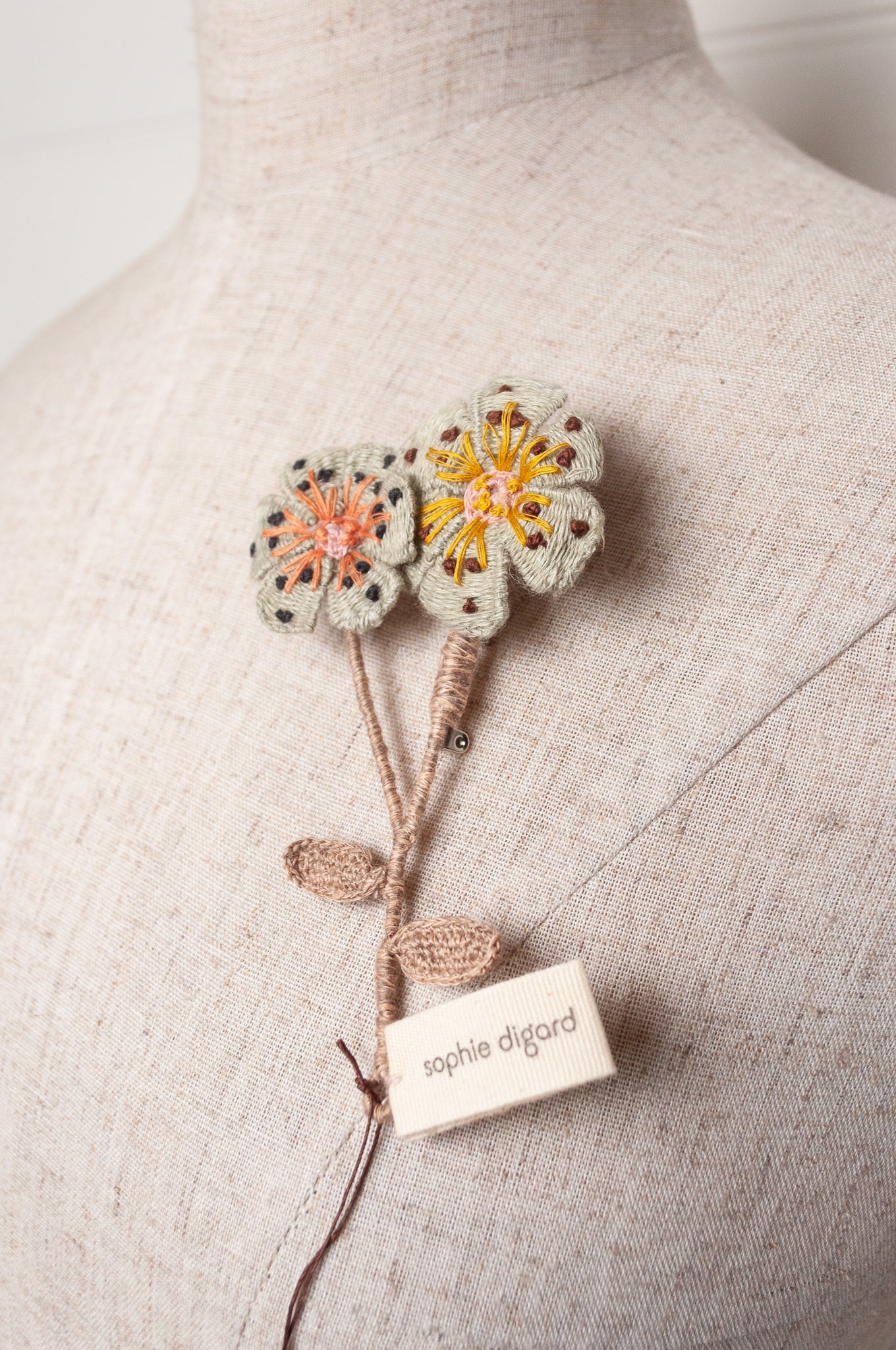 Sophie Digard two flower brooch in pale blue.