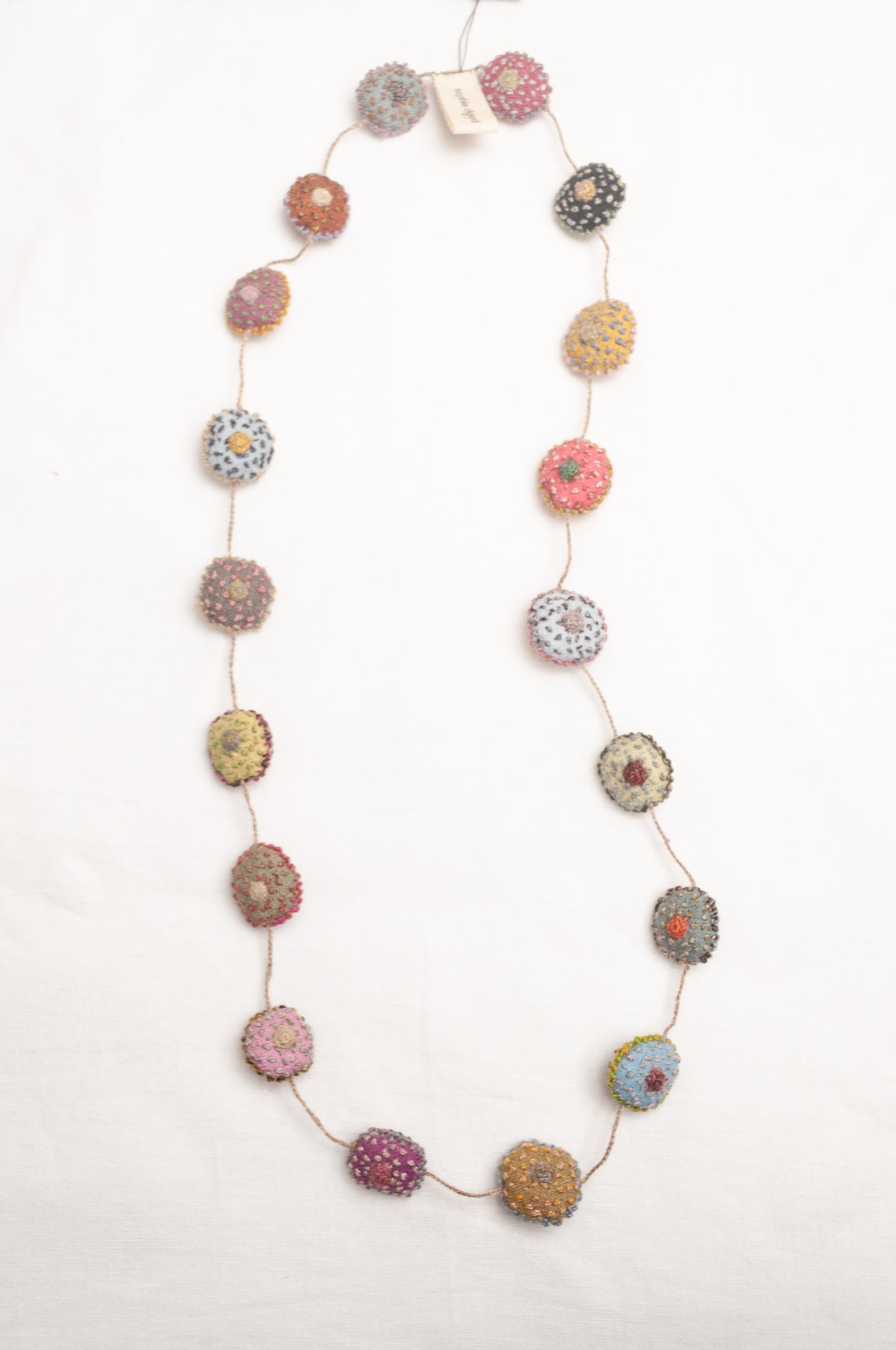 Sophie Digard necklace of embroidered linen medallions.
