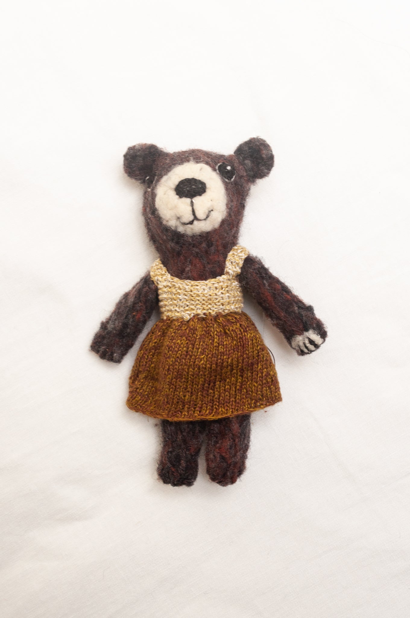 Sophie Digard poupee pure wool teddy bear in chocolate brown with brown and ecru dress.
