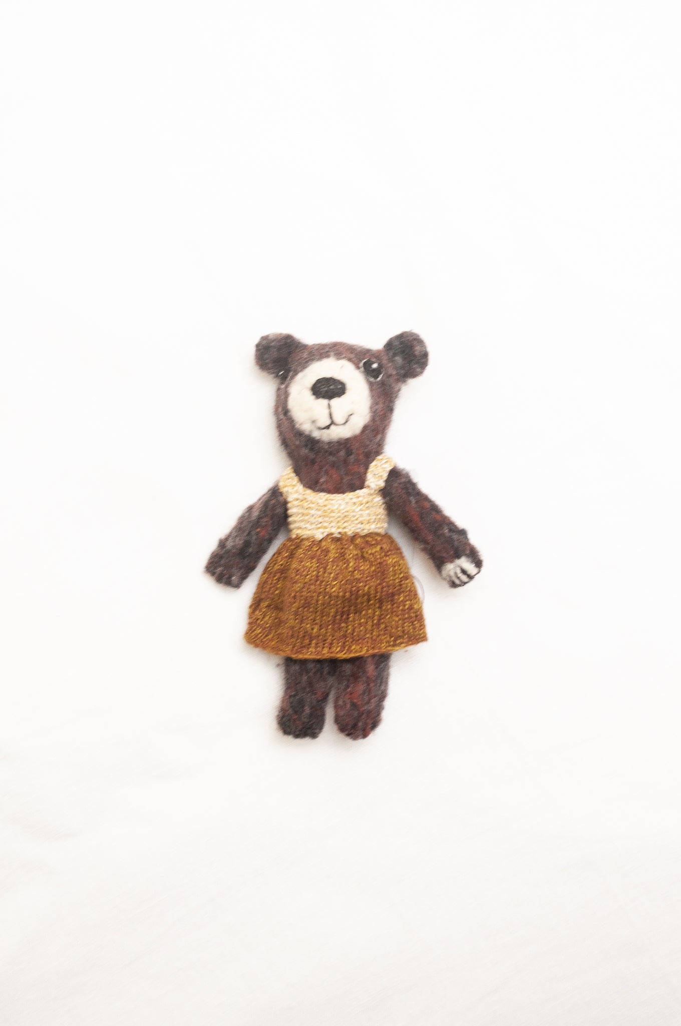 Sophie Digard poupee pure wool teddy bear in chocolate brown with brown and ecru dress.