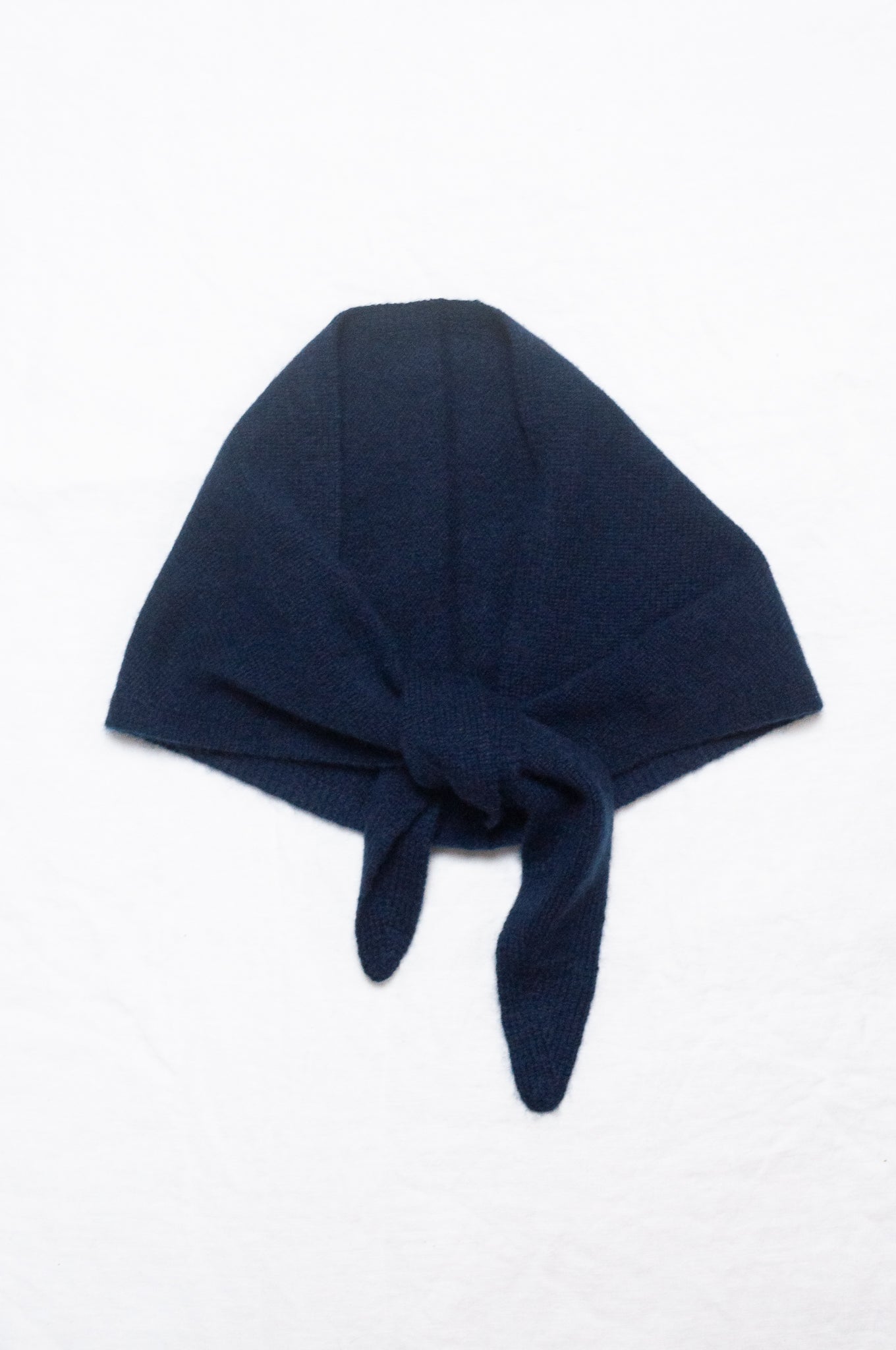 Cashmere triangle neck scarf in deep navy blue.