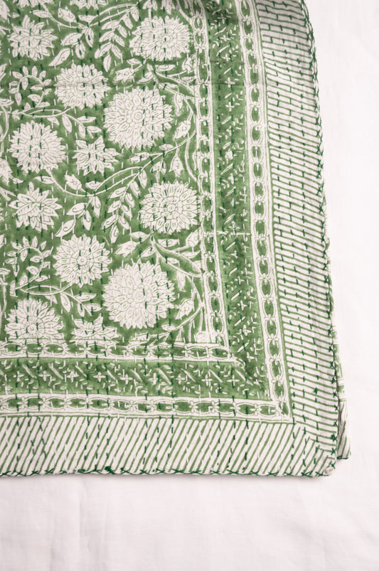 Cotton kantha quilt in grass green and white floral.