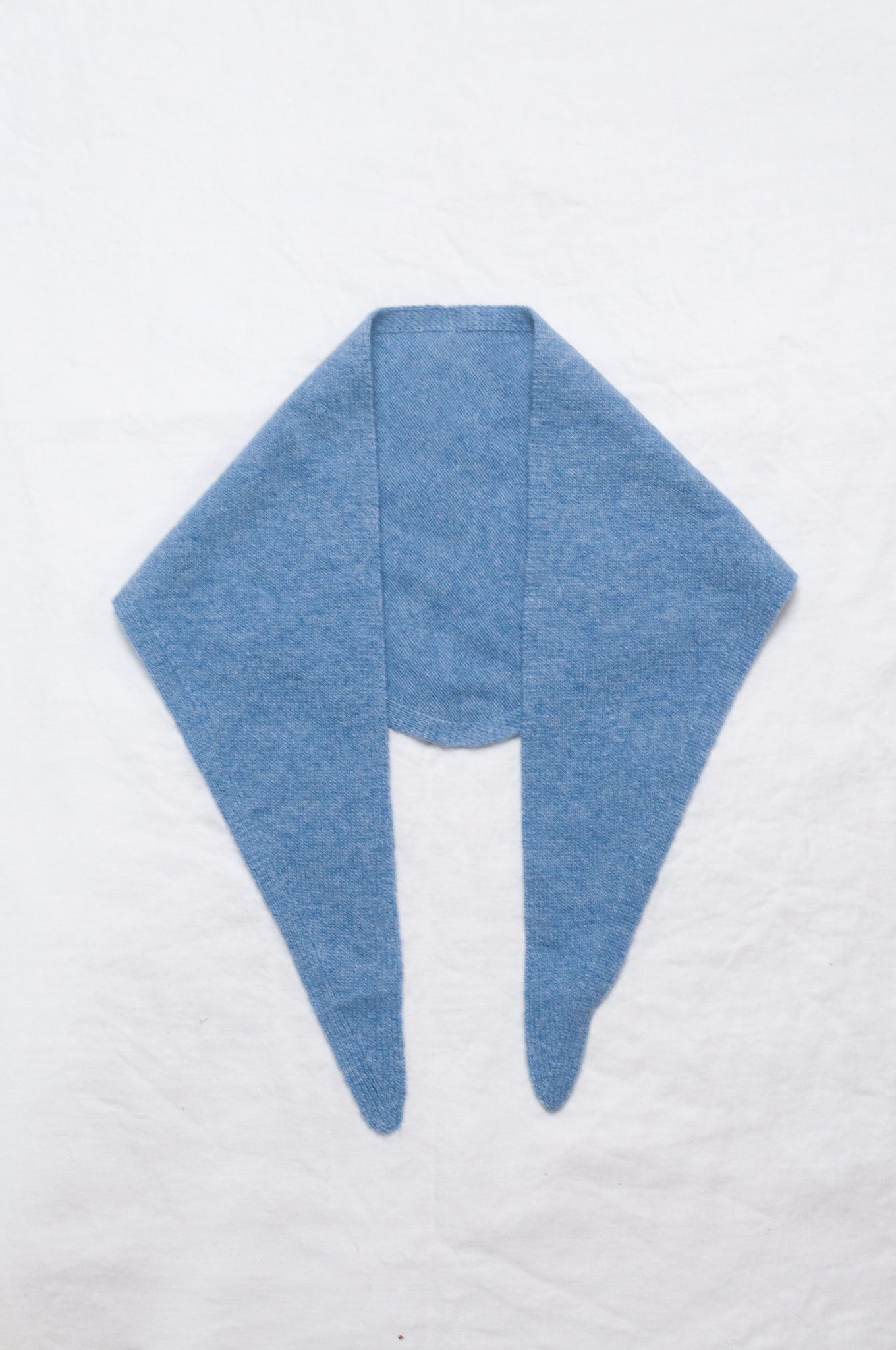 Cashmere triangle neck scarf in sky blue.