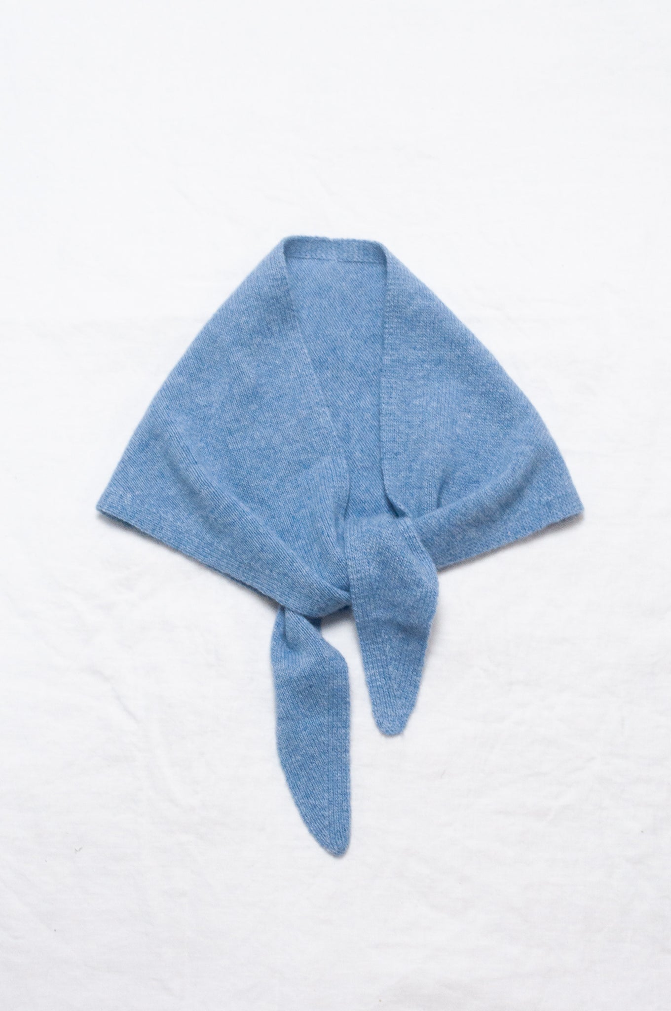 Cashmere triangle neck scarf in sky blue.