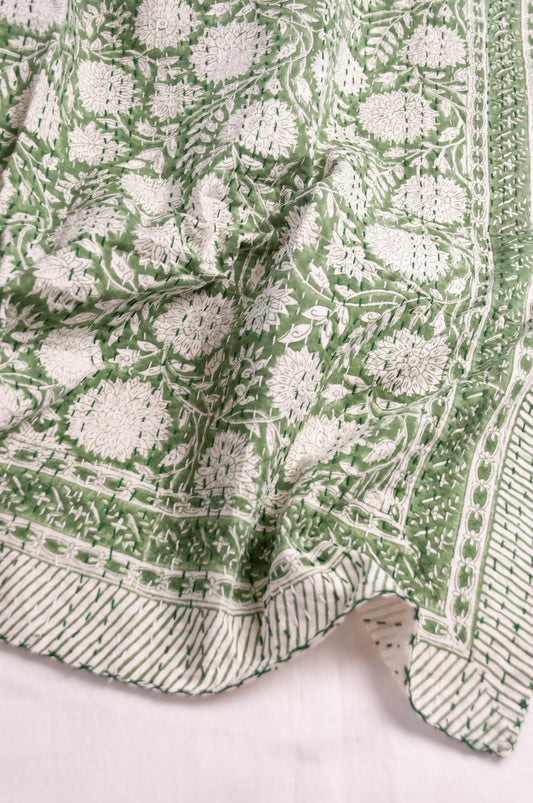 Cotton kantha quilt in grass green and white floral.