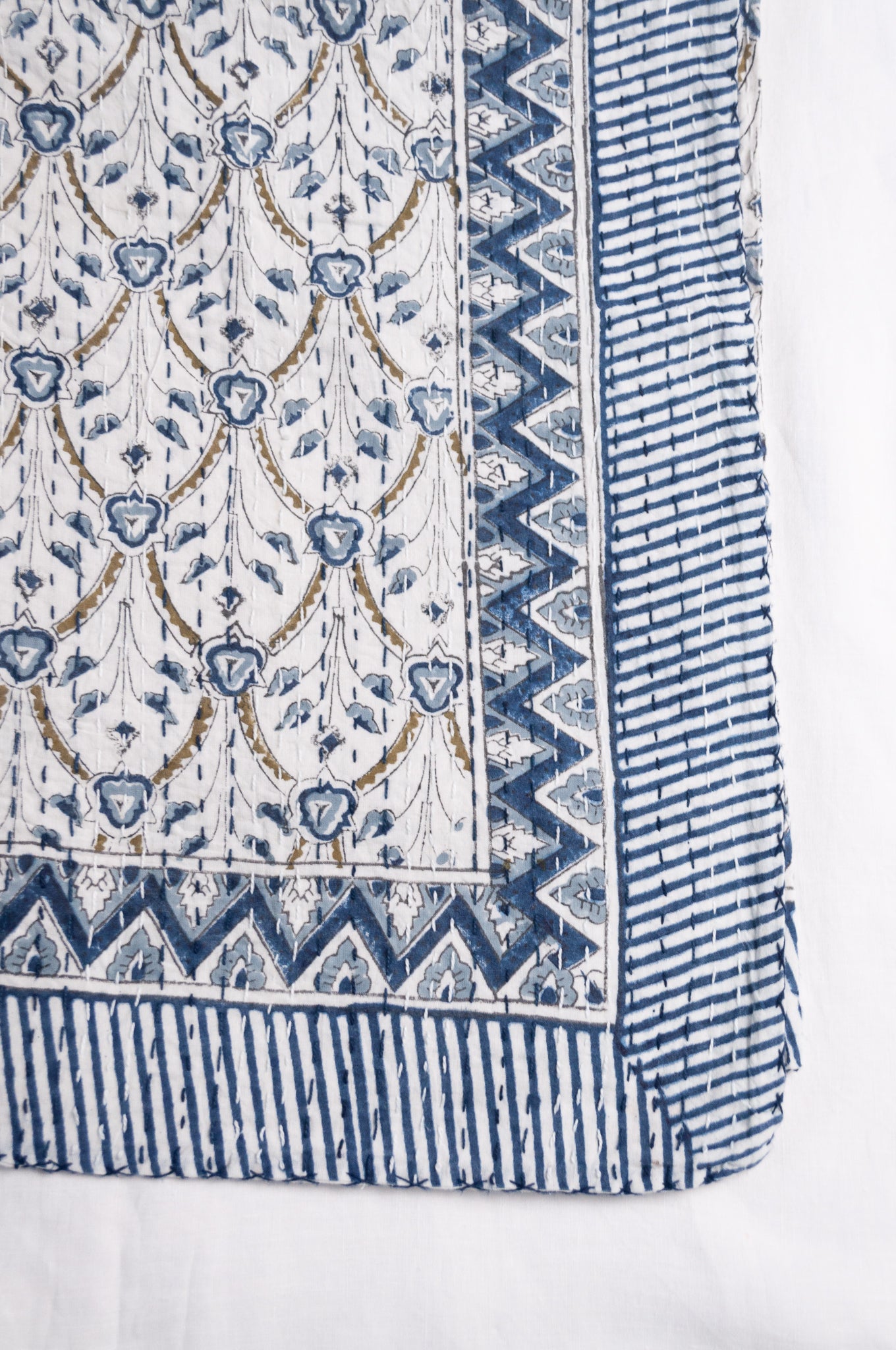 Blue and white floral blockprint cotton kantha quilt.