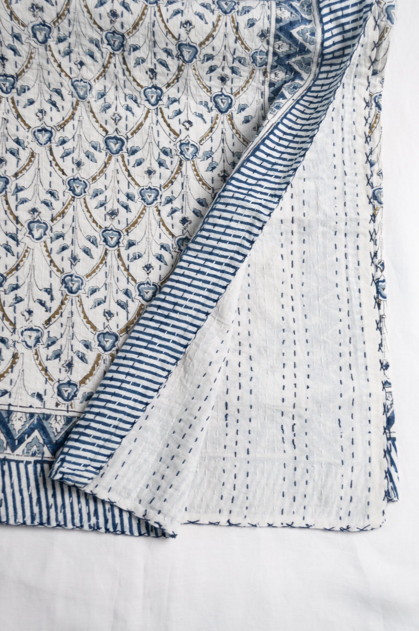 Blue and white floral blockprint cotton kantha quilt.