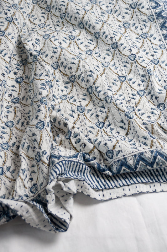 Blue and white floral blockprint cotton kantha quilt.