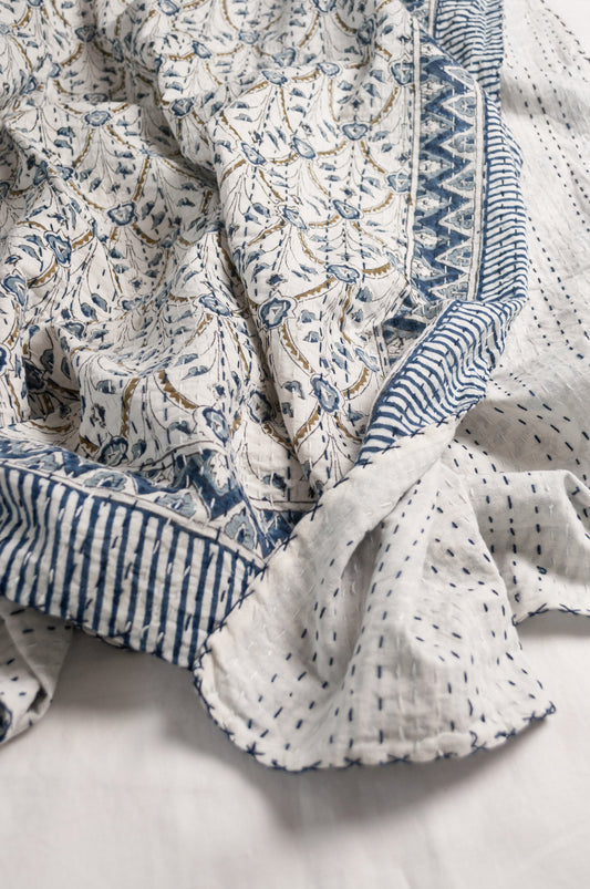Blue and white floral blockprint cotton kantha quilt.