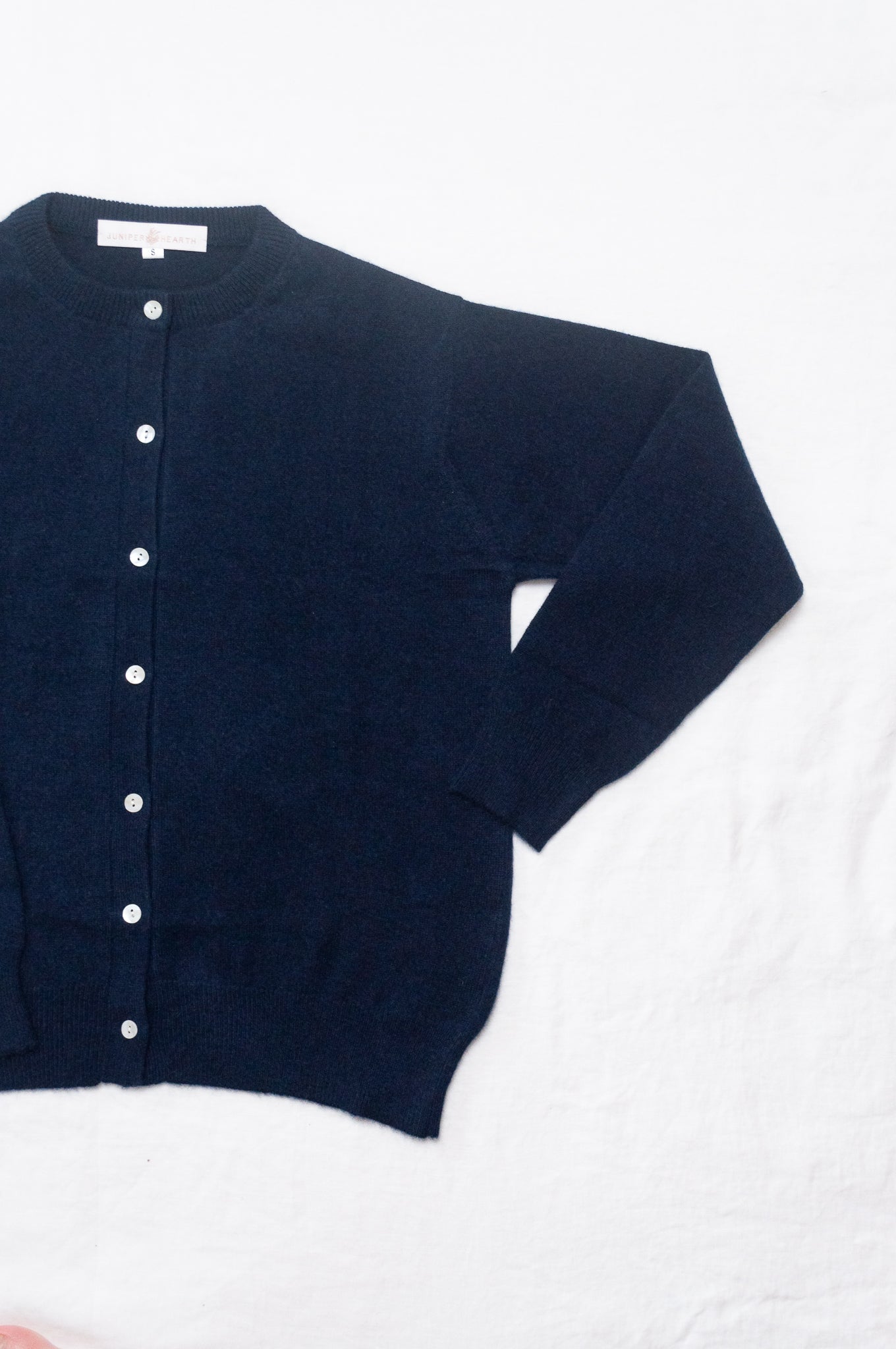 Classic cashmere crew neck cardigan in deep midnight navy blue.
