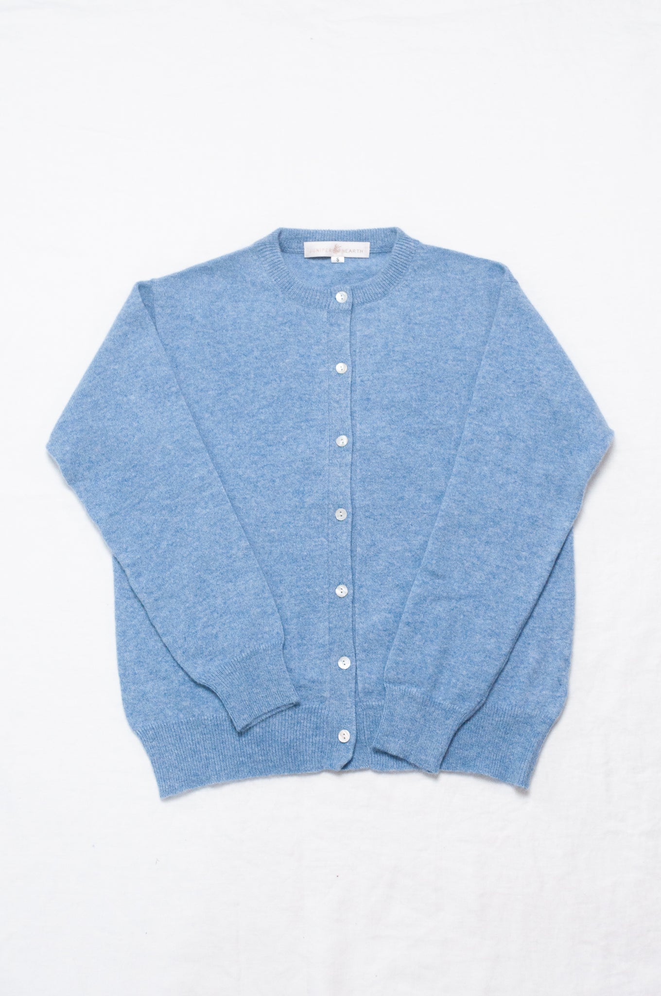 Juniper Hearth 100% cashmere button up crew neck cropped cardigan in sky blue.