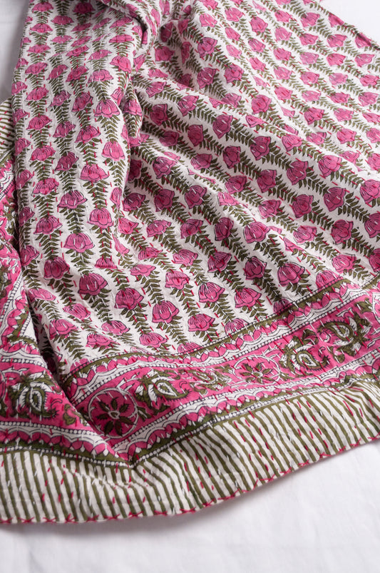 Pink green and white floral cotton kantha quilt.