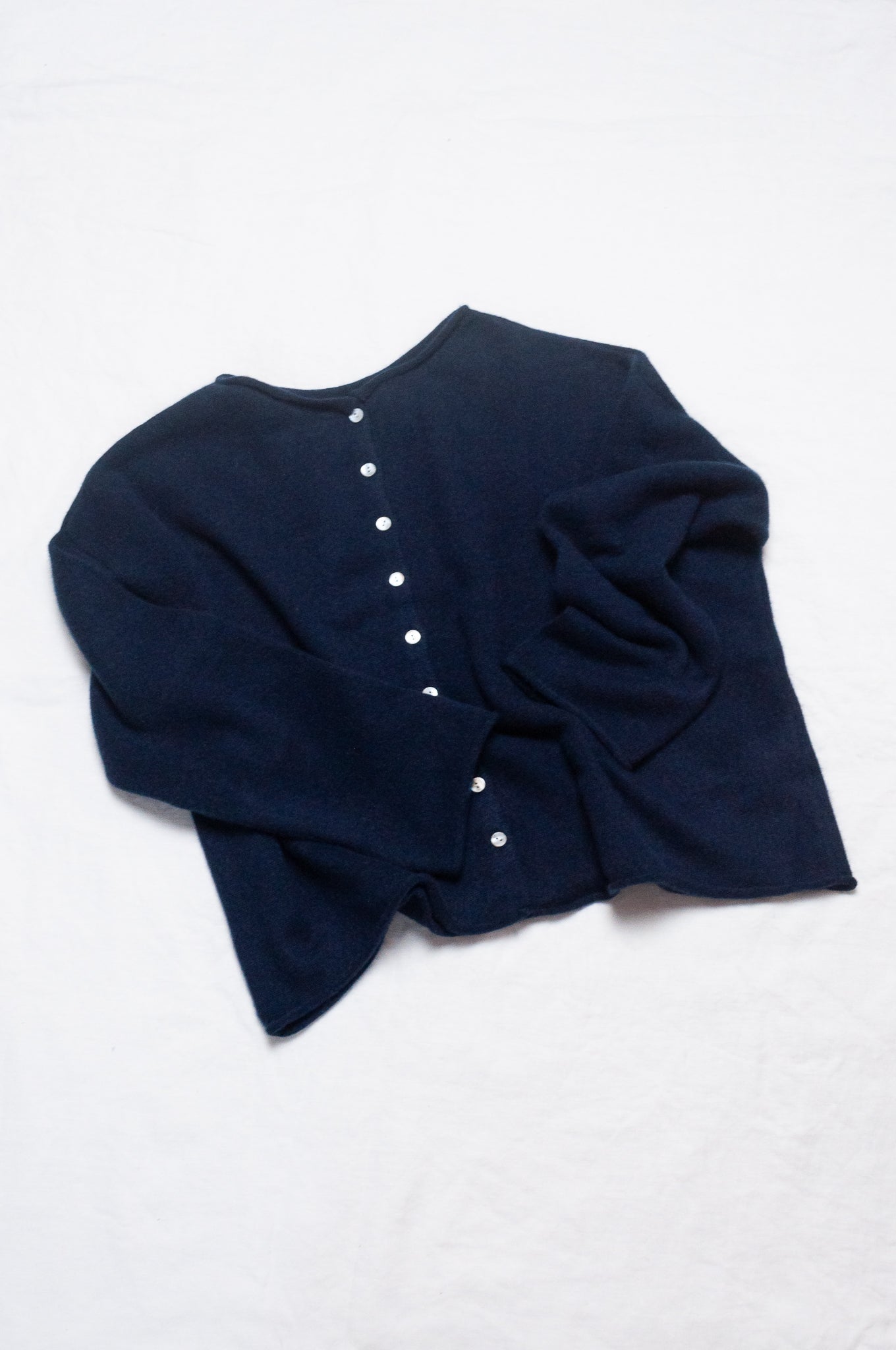 One size reversible cashmere cardigan in deep midnight navy blue.