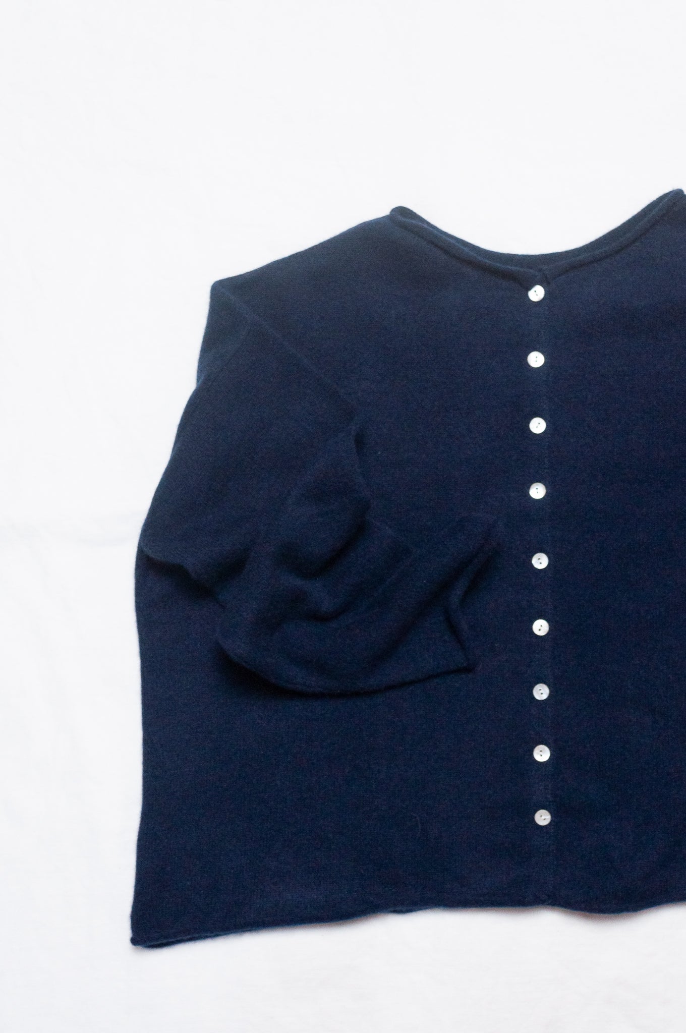 One size reversible cashmere cardigan in deep midnight navy blue.