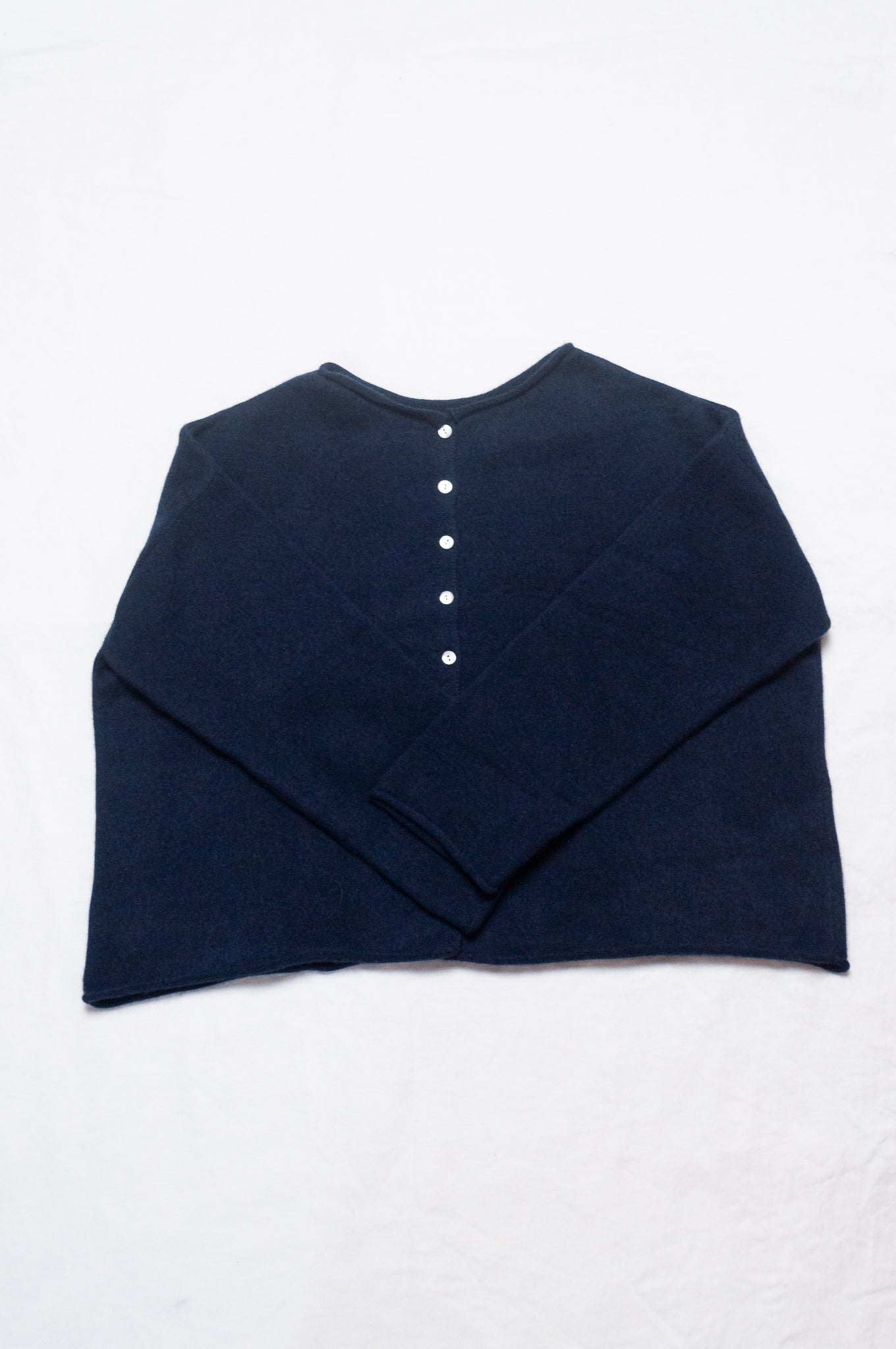 One size reversible cashmere cardigan in deep midnight navy blue.