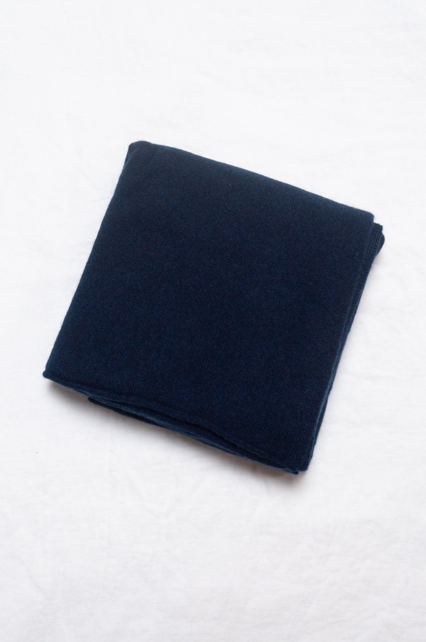 Generous sized cashmere scarf in deep navy blue.