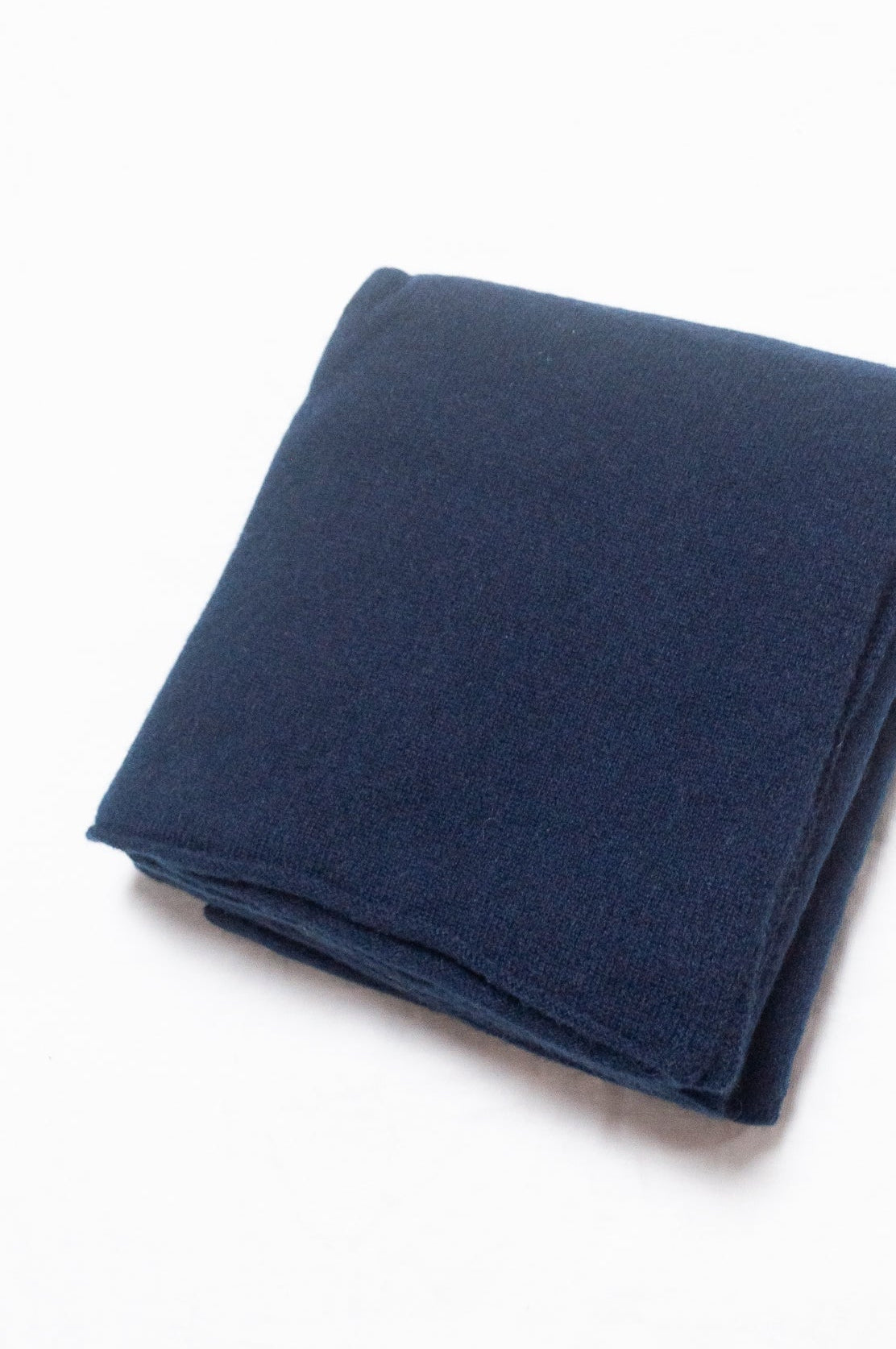 Generous sized cashmere scarf in deep navy blue.