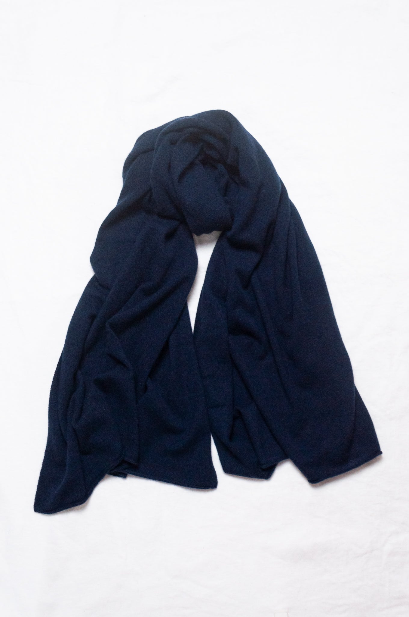 Generous sized cashmere scarf in deep navy blue.