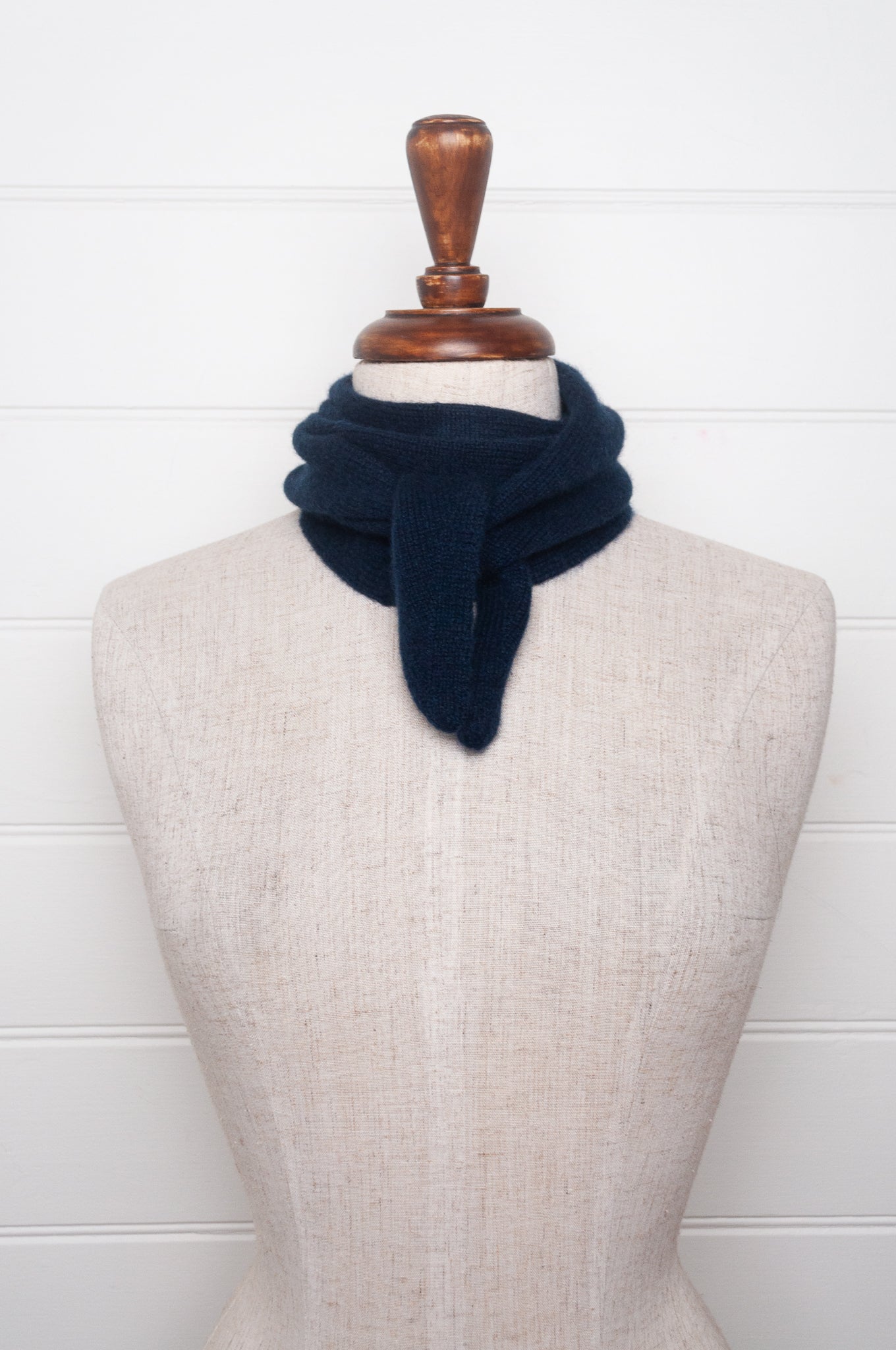Cashmere triangle neck scarf in deep navy blue.