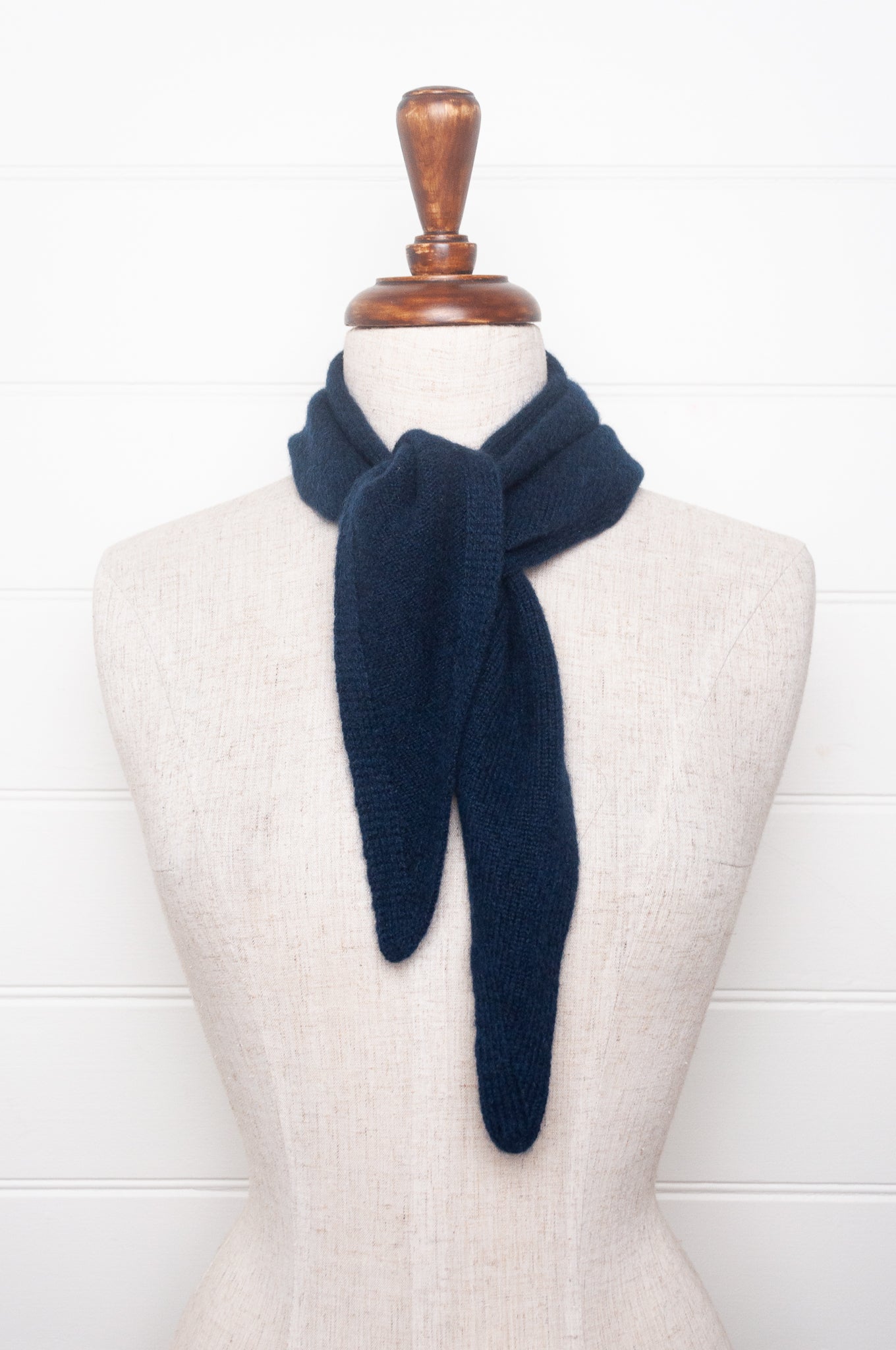 Cashmere triangle neck scarf in deep navy blue.