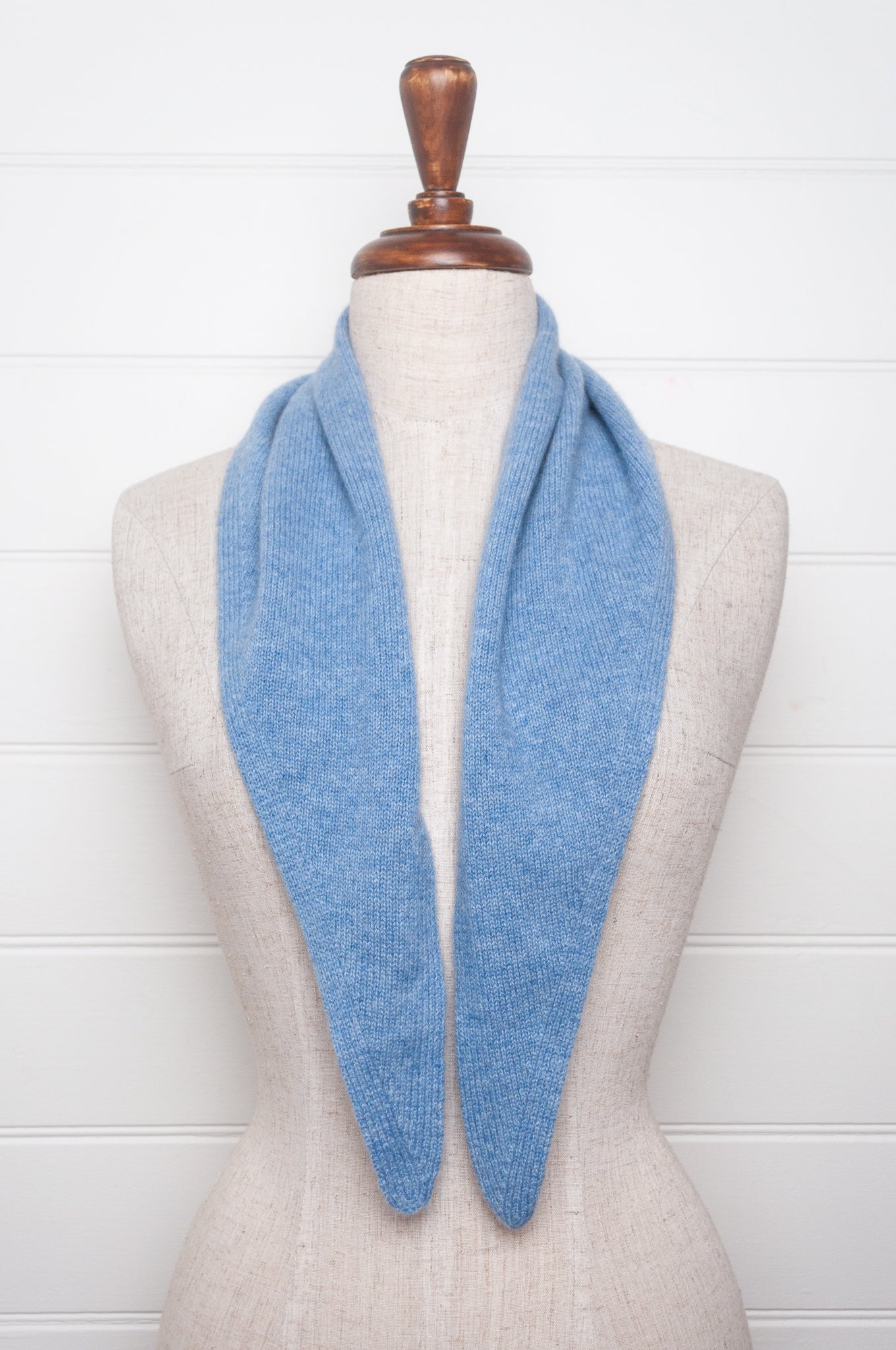 Cashmere triangle neck scarf in sky blue.