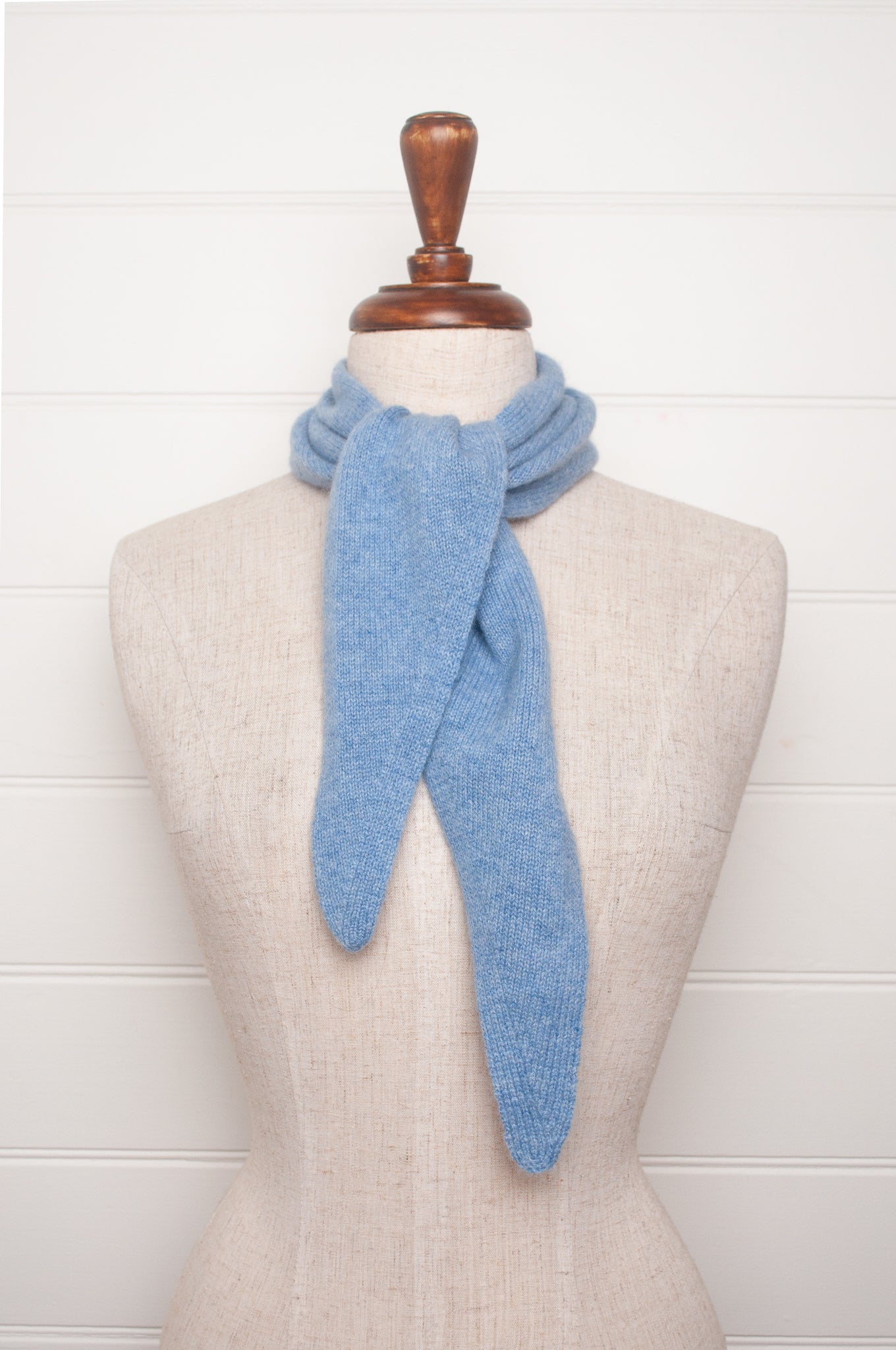 Cashmere triangle neck scarf in sky blue.