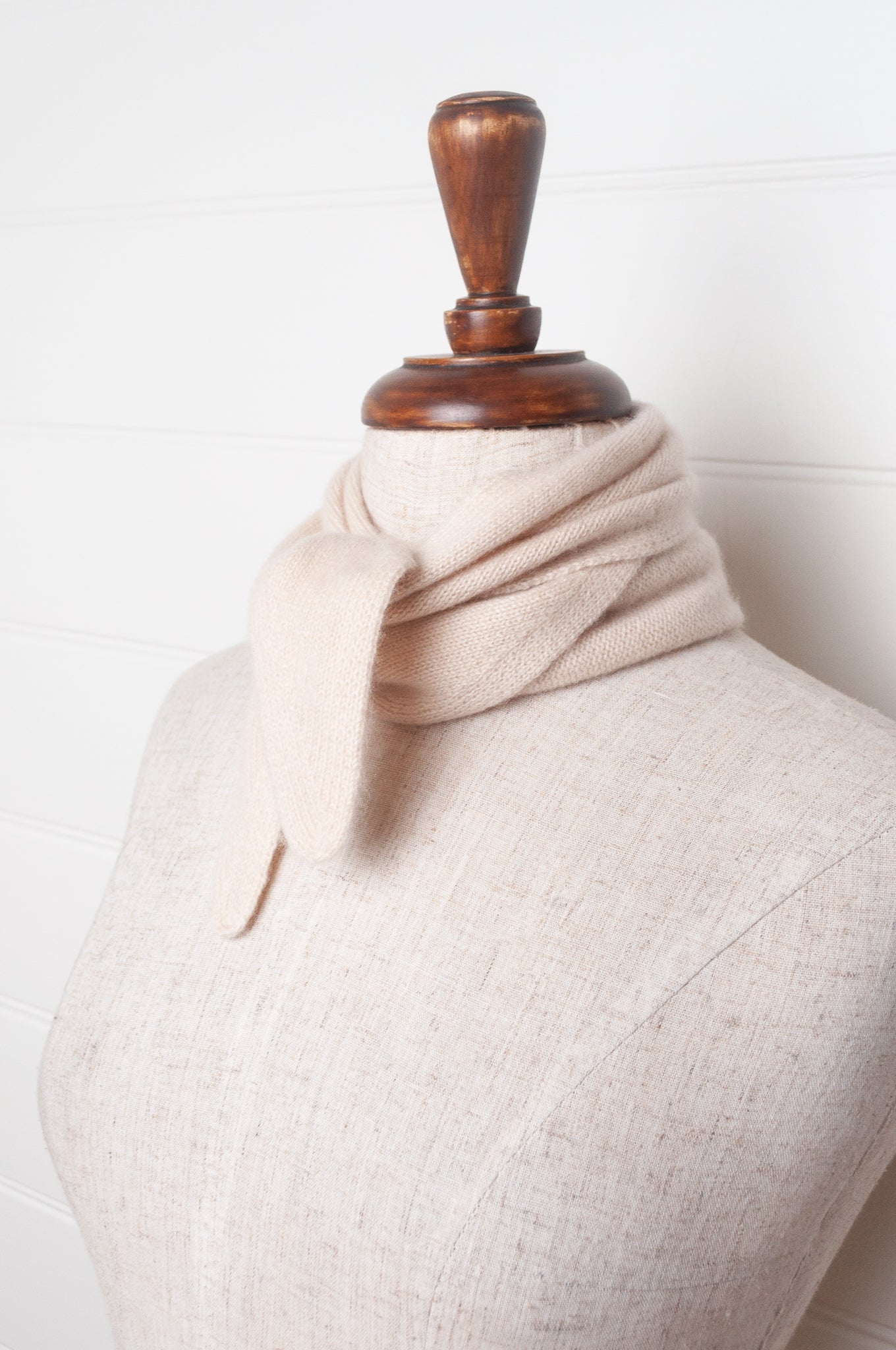 Cashmere triangle neck scarf in ecru cream.