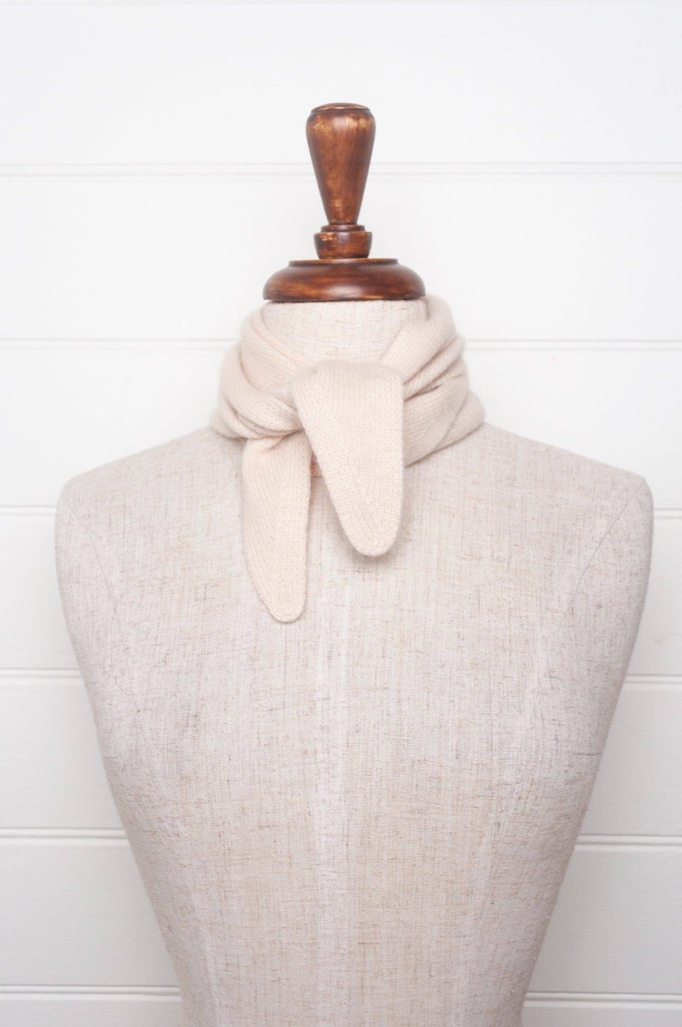 Cashmere triangle neck scarf in ecru cream.