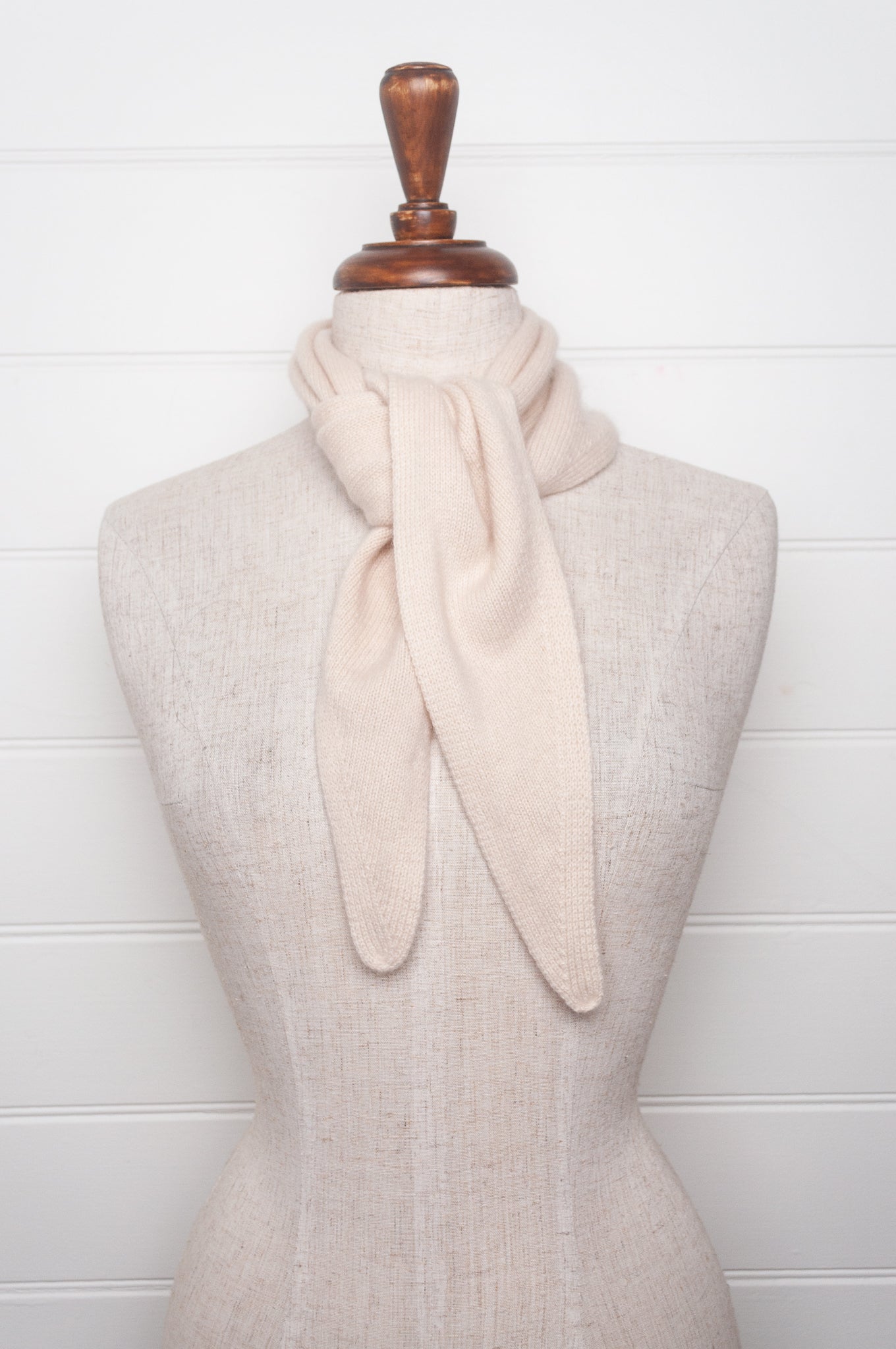 Cashmere triangle neck scarf in ecru cream.